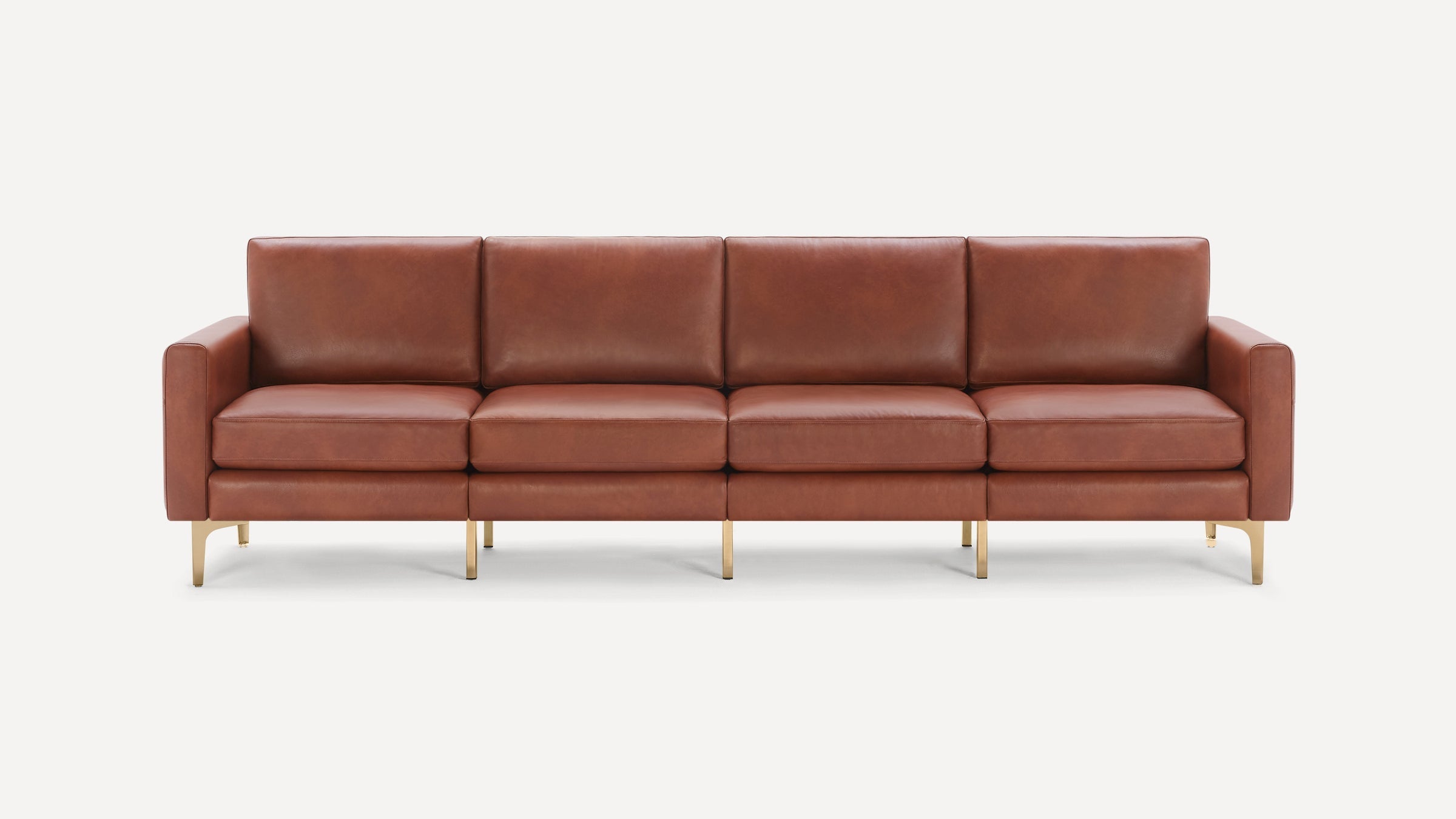 Four-seat modern sofa with brown leather upholstery and slim metallic gold legs on white background.