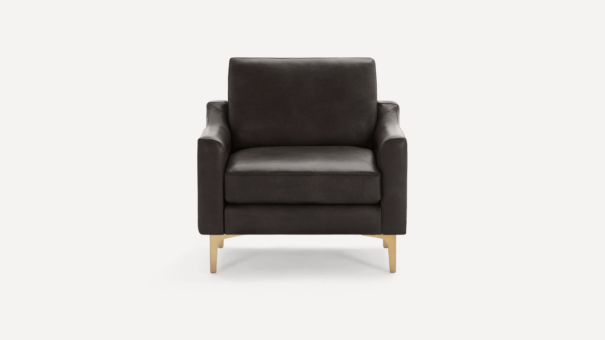Front view of a modern dark brown leather armchair with gold metal legs and cushioned seat and backrest.