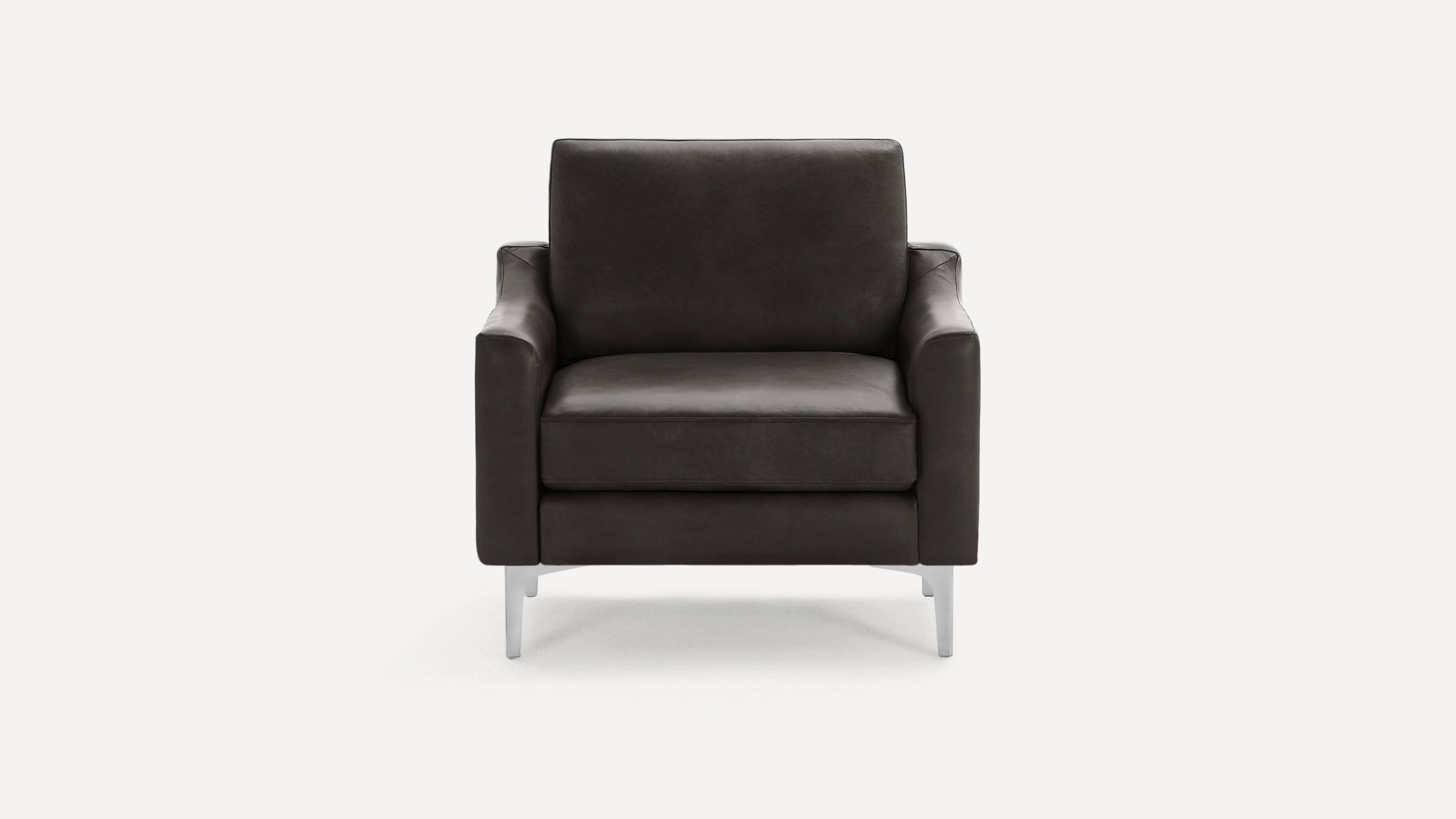 Modern black leather armchair with sleek metal legs, square arms, and a cushioned backrest and seat.