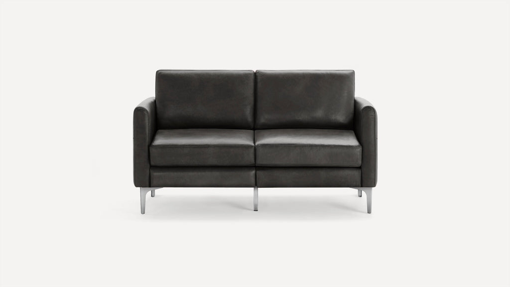 Modern two-seater black leather sofa with straight armrests and sleek metal legs, set against a plain white background.