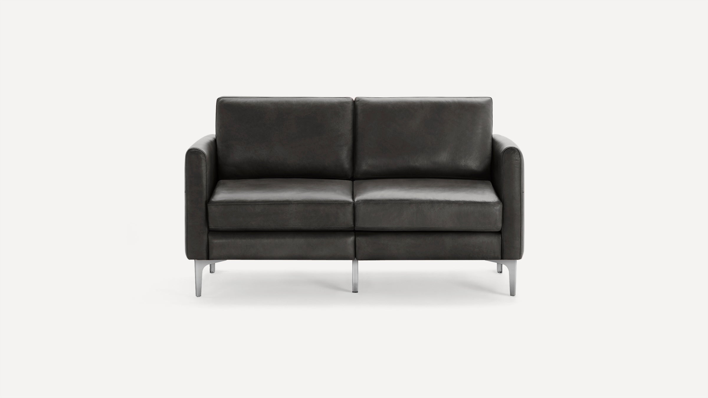 Modern two-seater black leather sofa with straight armrests and sleek metal legs, set against a plain white background.