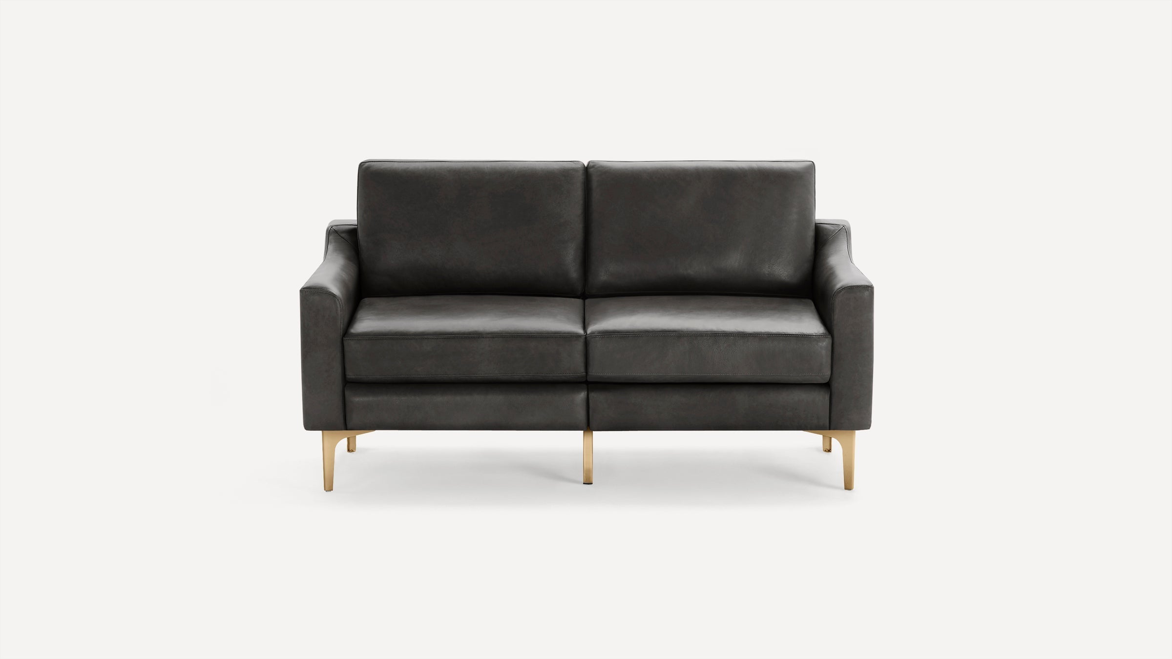 Modern dark gray leather two-seater sofa with slim armrests and gold metal legs, set against a plain white background.