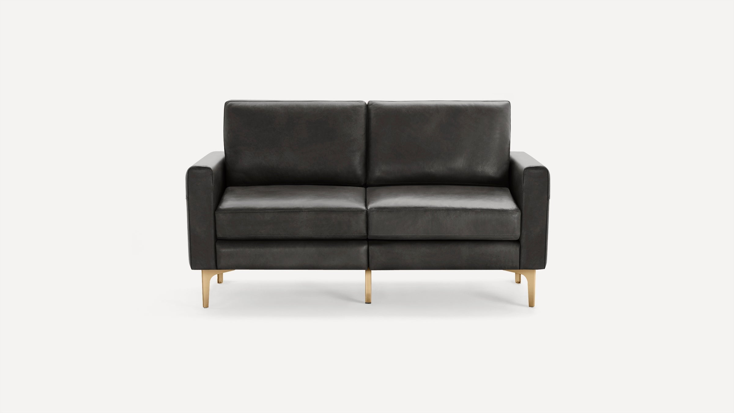 Modern two-seater sofa with dark gray leather upholstery and gold metal legs, featuring clean lines and cushioned armrests.