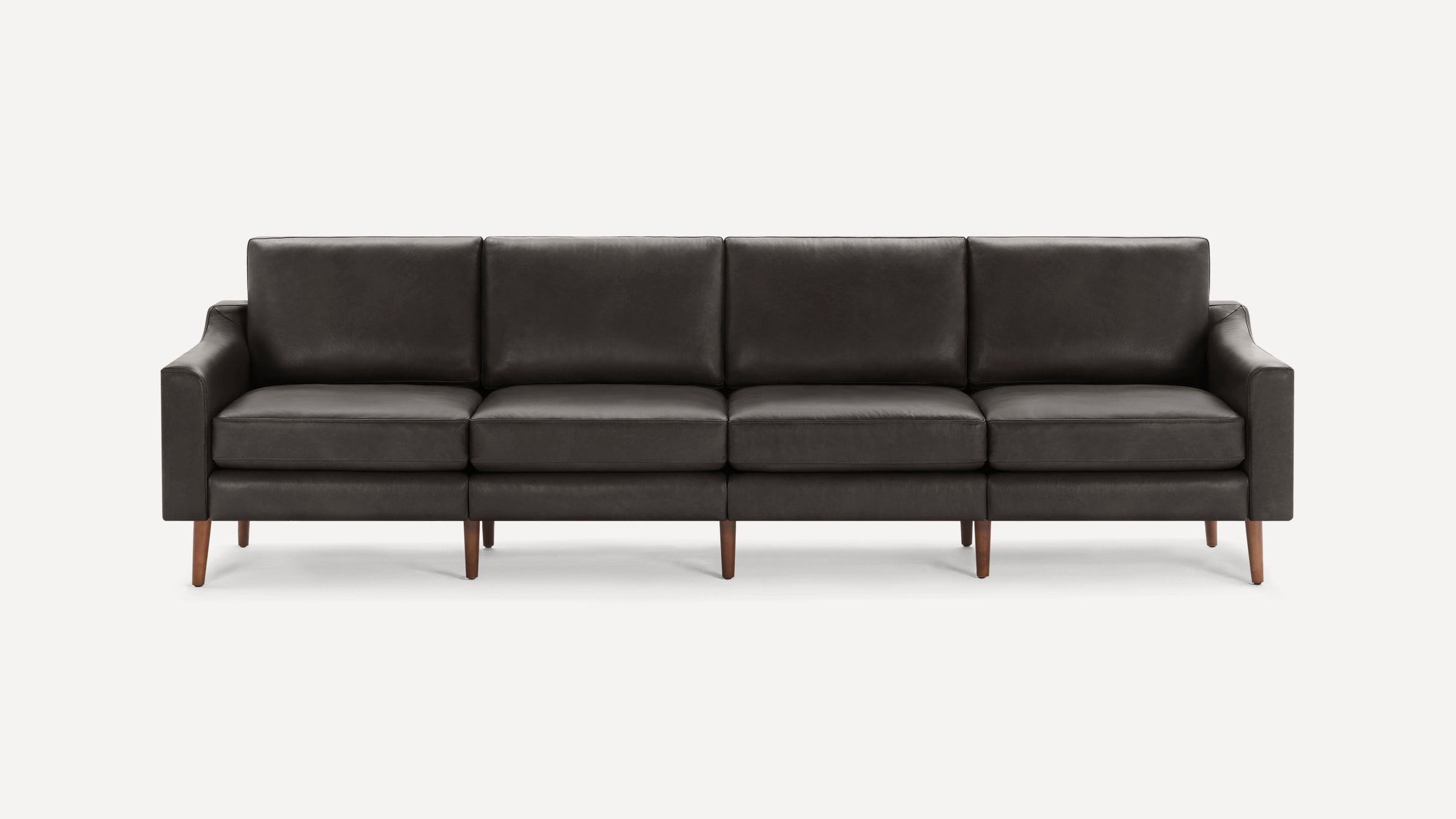 Four-seater modern sofa with dark gray leather upholstery and wooden legs, featuring clean lines and cushioned seats.