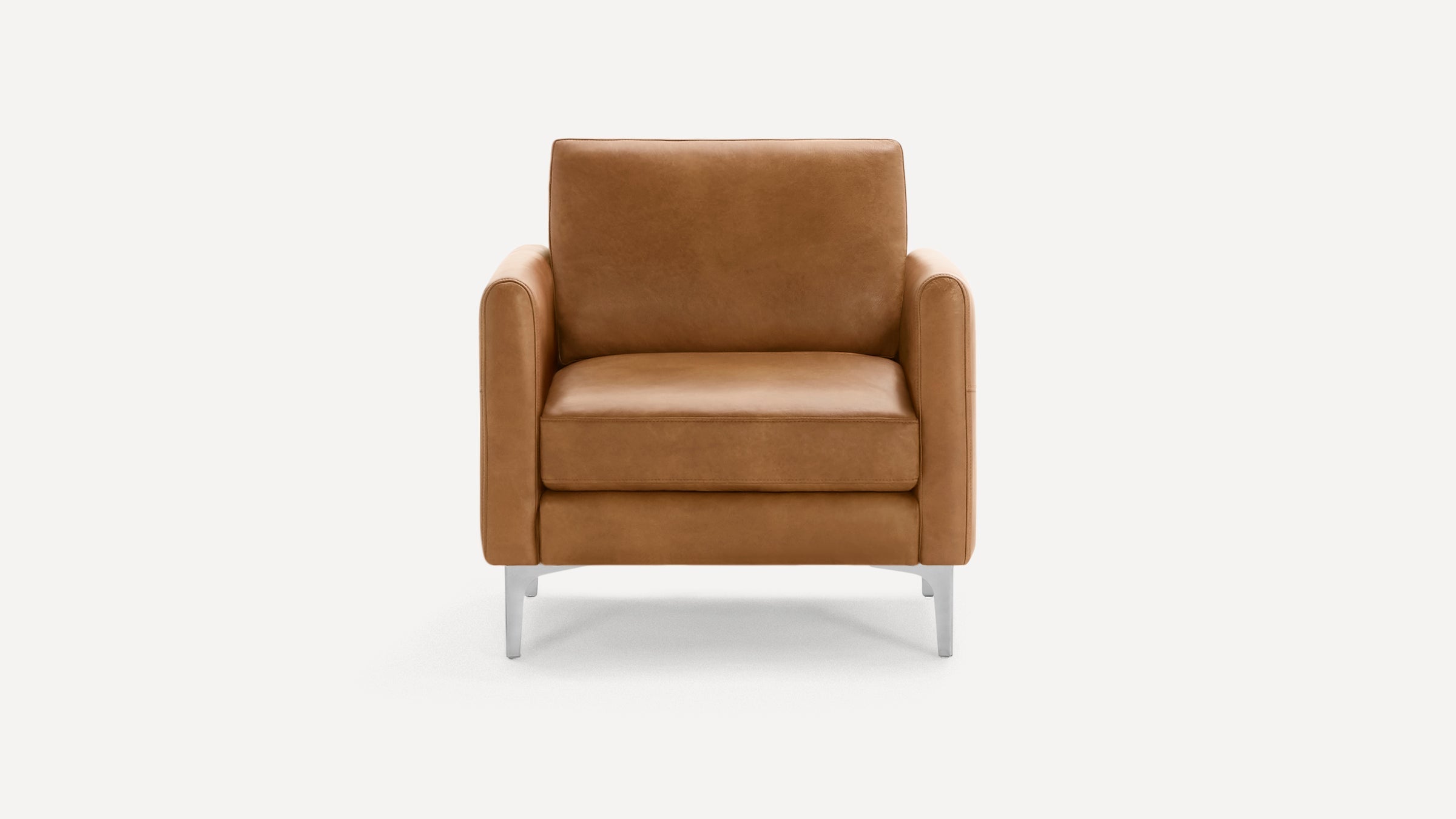 Front view of a modern, tan leather armchair with clean lines and metal legs against a plain white background.
