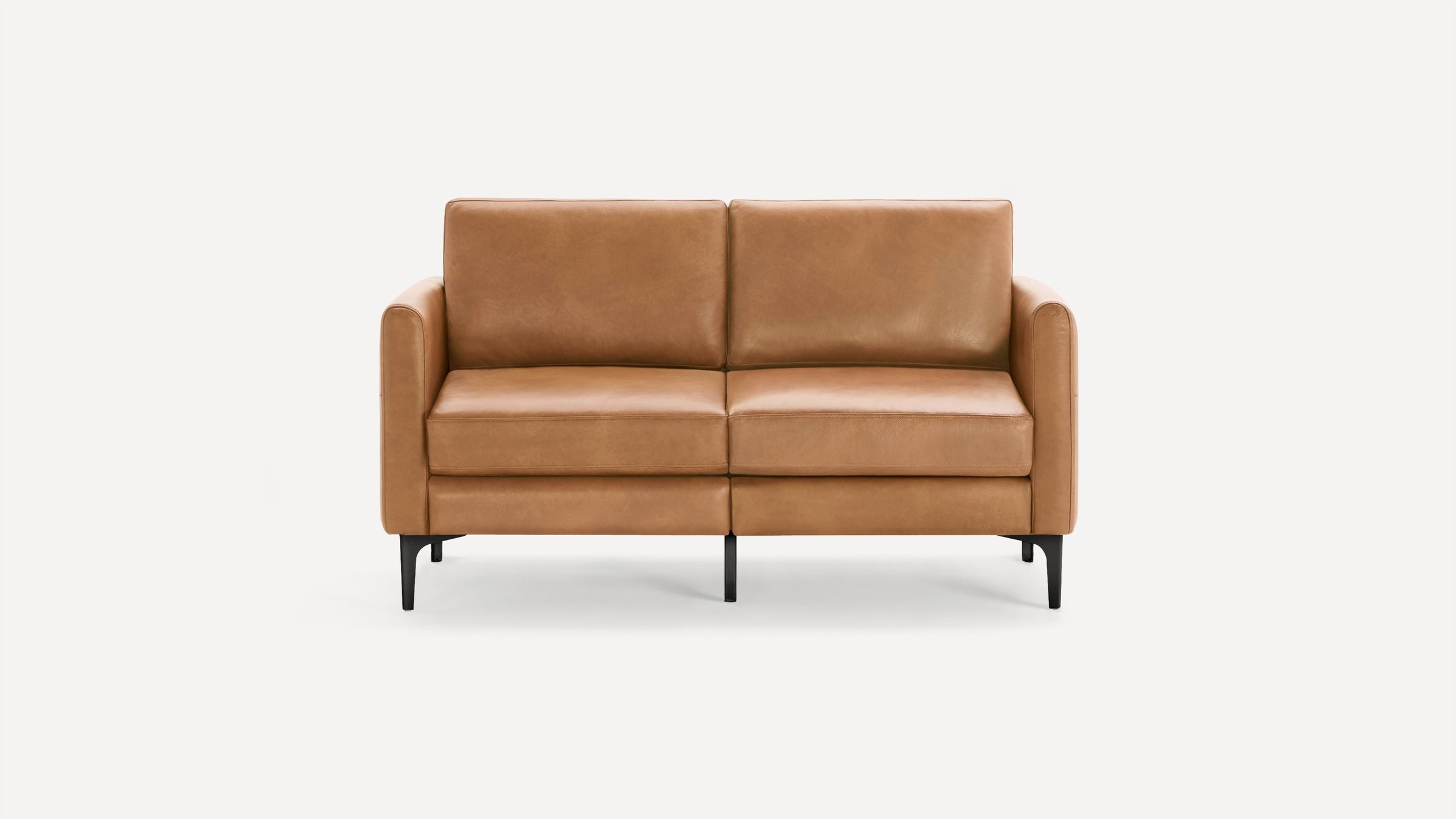 Two-seater modern sofa with light brown leather upholstery and black tapered legs, shown against a plain white background.