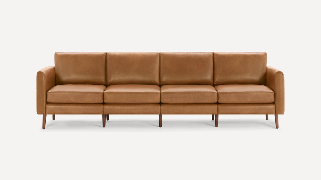 Four-seat mid-century modern sofa with straight arms, brown leather upholstery, and tapered wooden legs on white background.