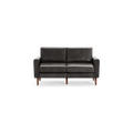 Dark gray leather two-seater sofa with square arms and wooden legs, modern and minimalist design.