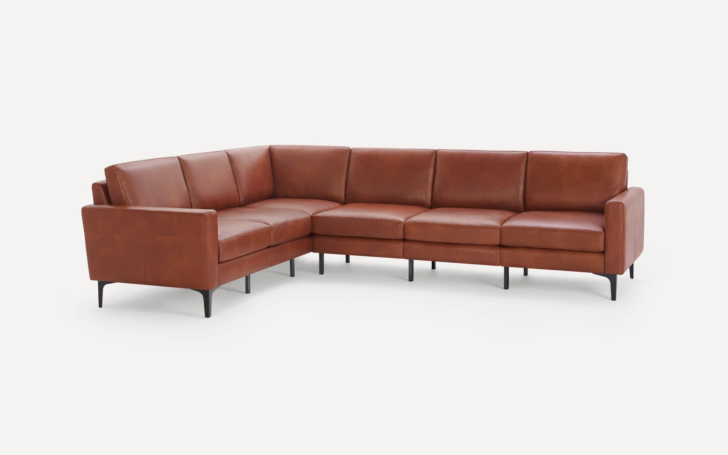 Modern L-shaped sectional sofa in brown leather with slim black metal legs, clean lines, and cushioned seating and backrests.