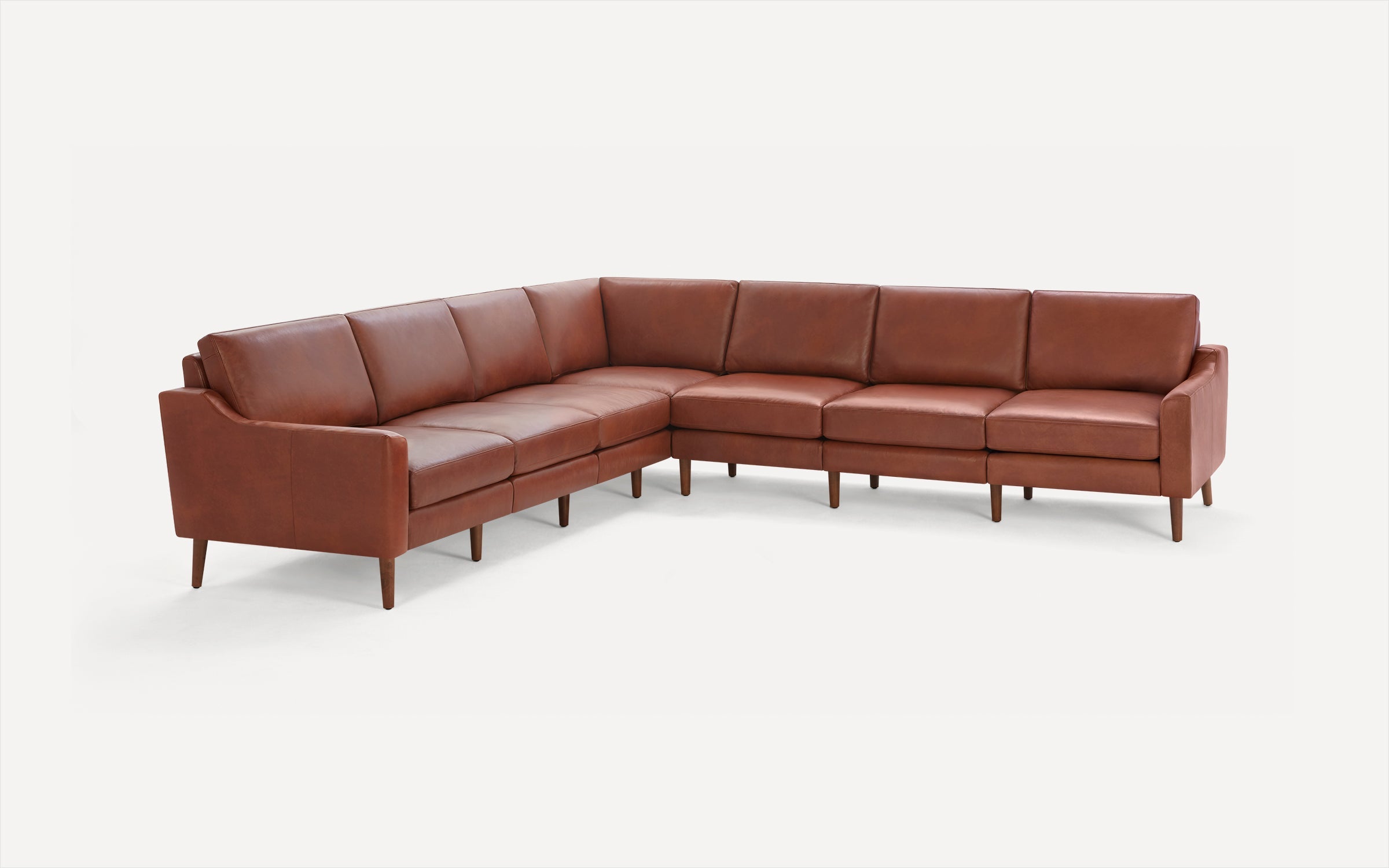 Modern L-shaped sectional sofa in rich brown leather with clean lines and wooden tapered legs.