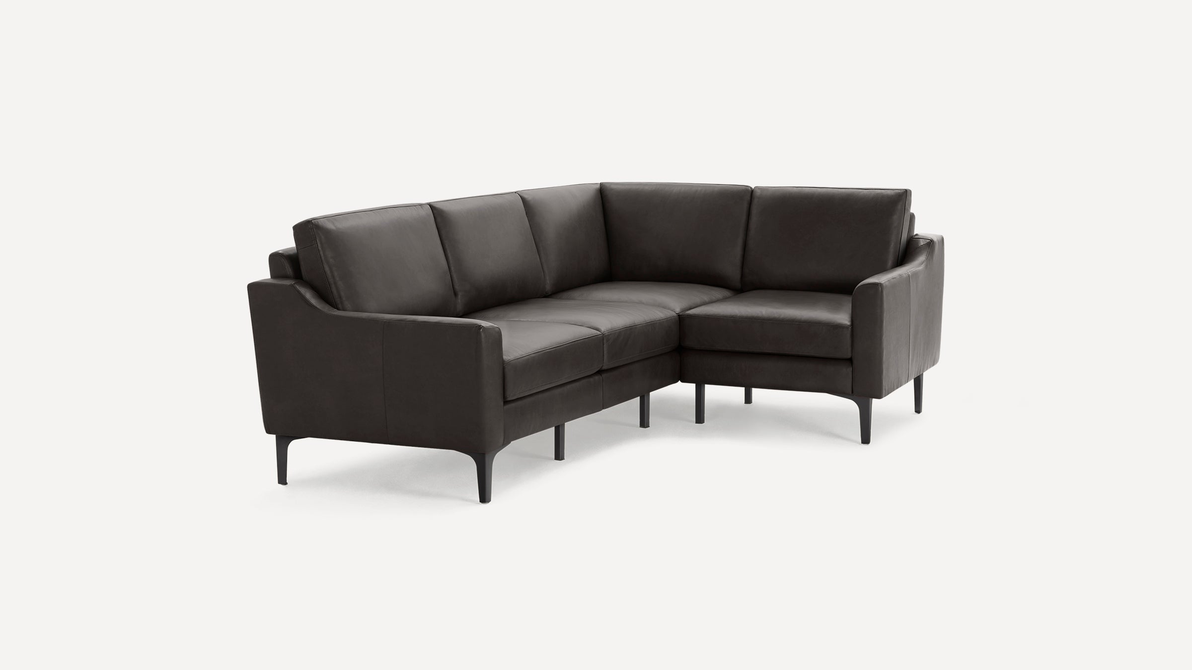 Modern dark gray leather L-shaped sectional sofa with clean lines and slim black legs, set against a white background.