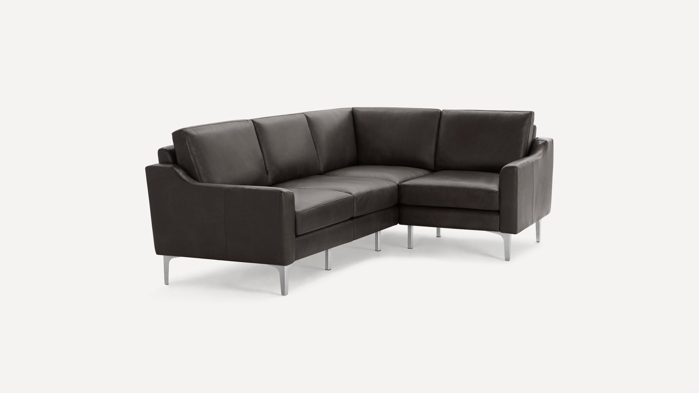 Dark gray leather sectional sofa with clean lines, cushioned seats and backs, and slender silver metal legs.