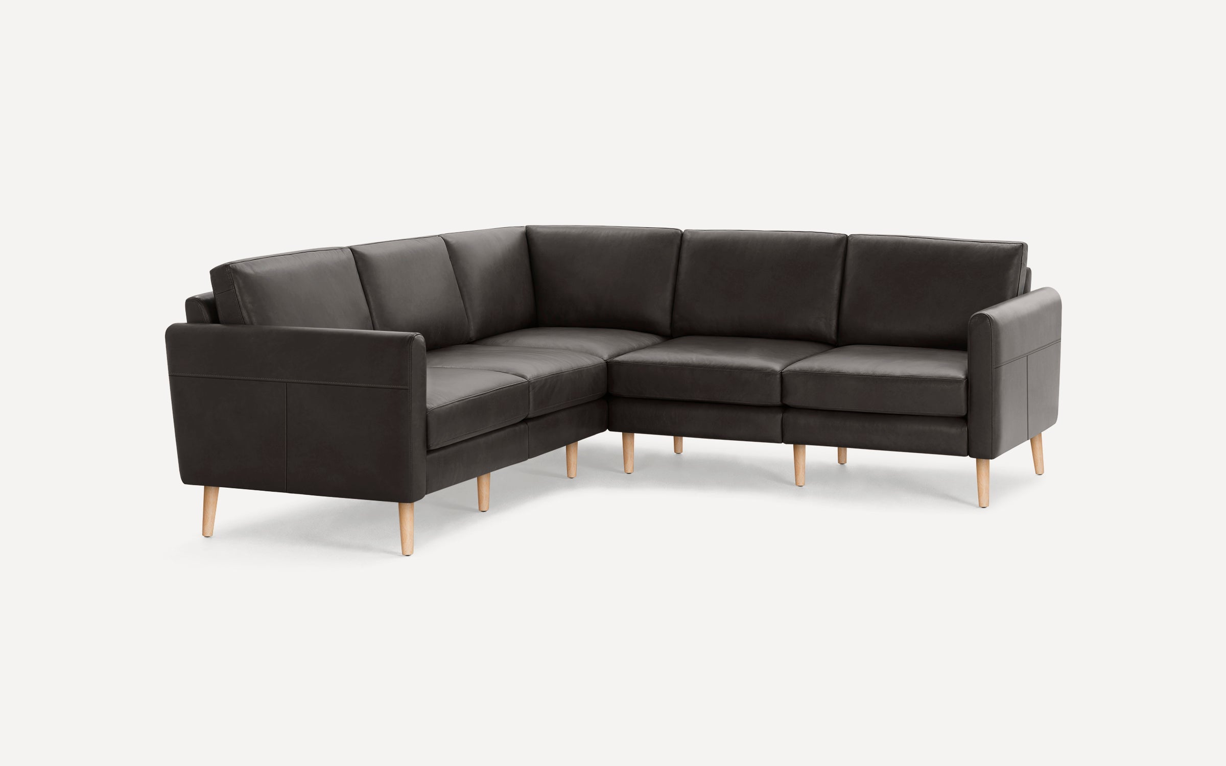 Dark gray sectional sofa with clean lines, wooden legs, cushioned seats, and armrests, designed for modern living rooms.