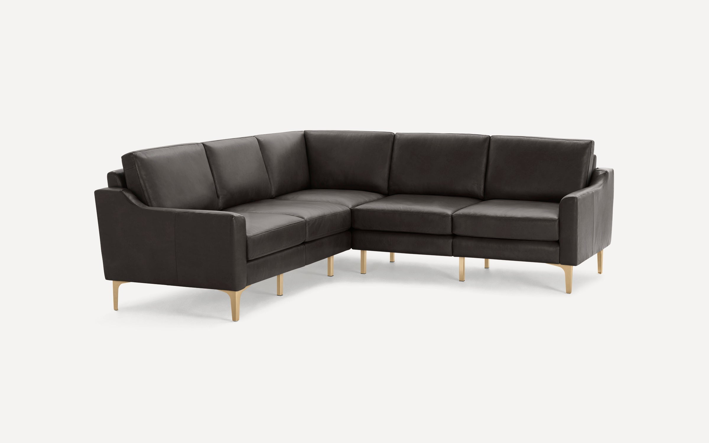 Modern L-shaped sectional sofa in dark gray leather with slim gold metal legs and clean lines, designed for corner seating.