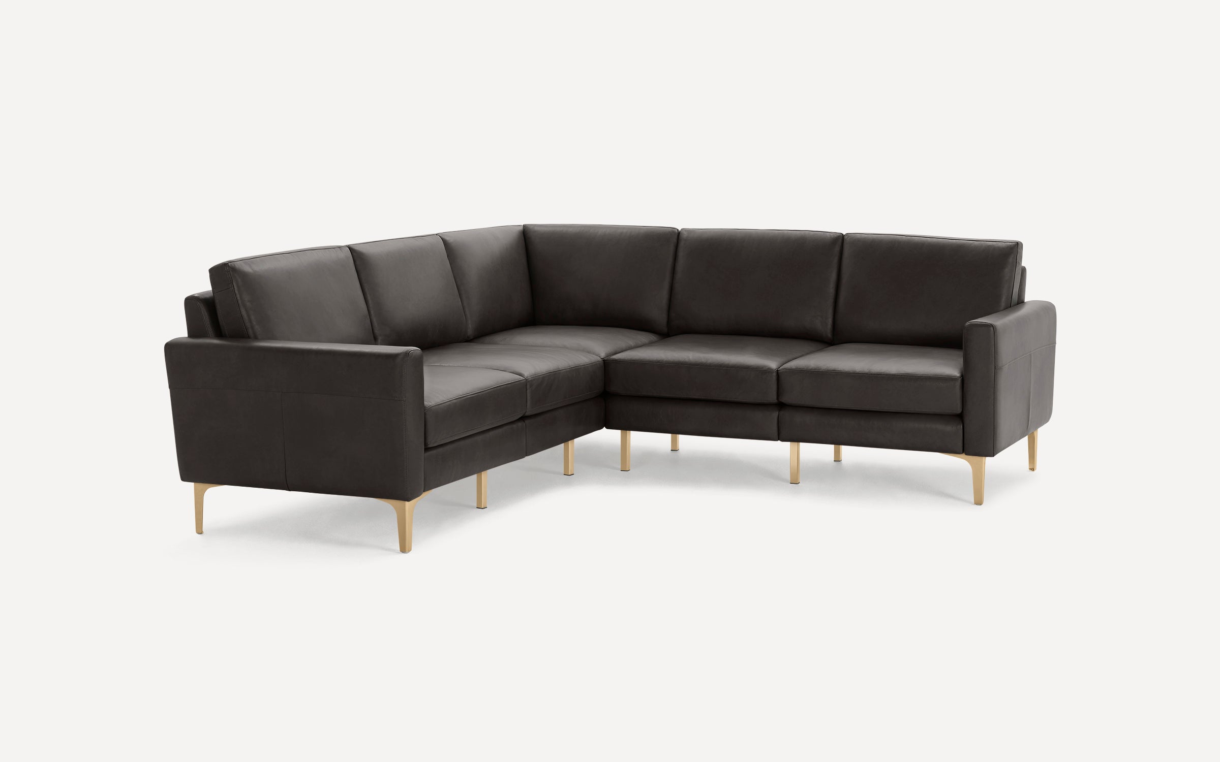 Dark gray L-shaped sectional sofa with clean lines and gold metal legs, featuring cushioned seats and armrests.