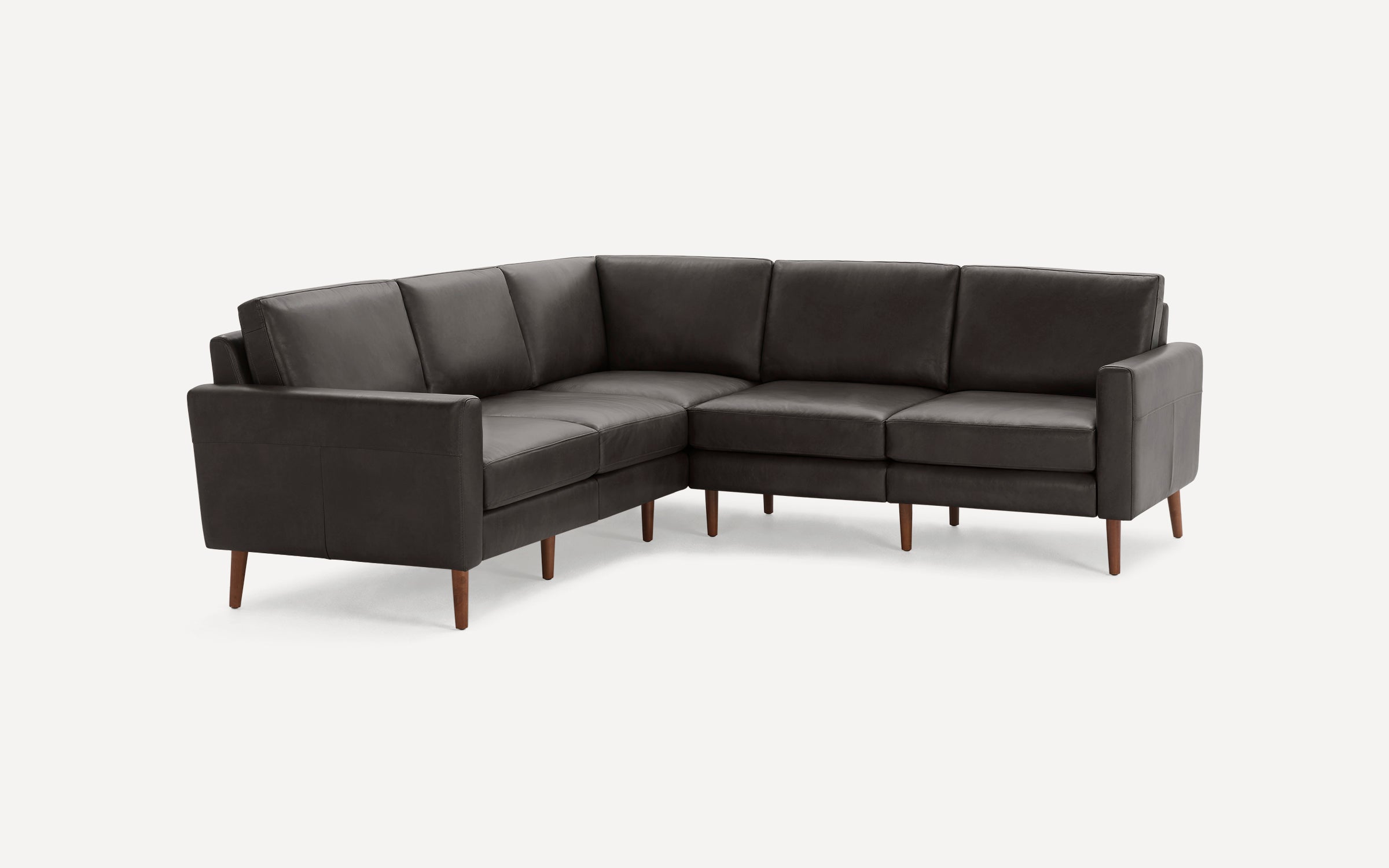 Dark gray leather sectional sofa with clean lines and wooden tapered legs, designed for modern living spaces.