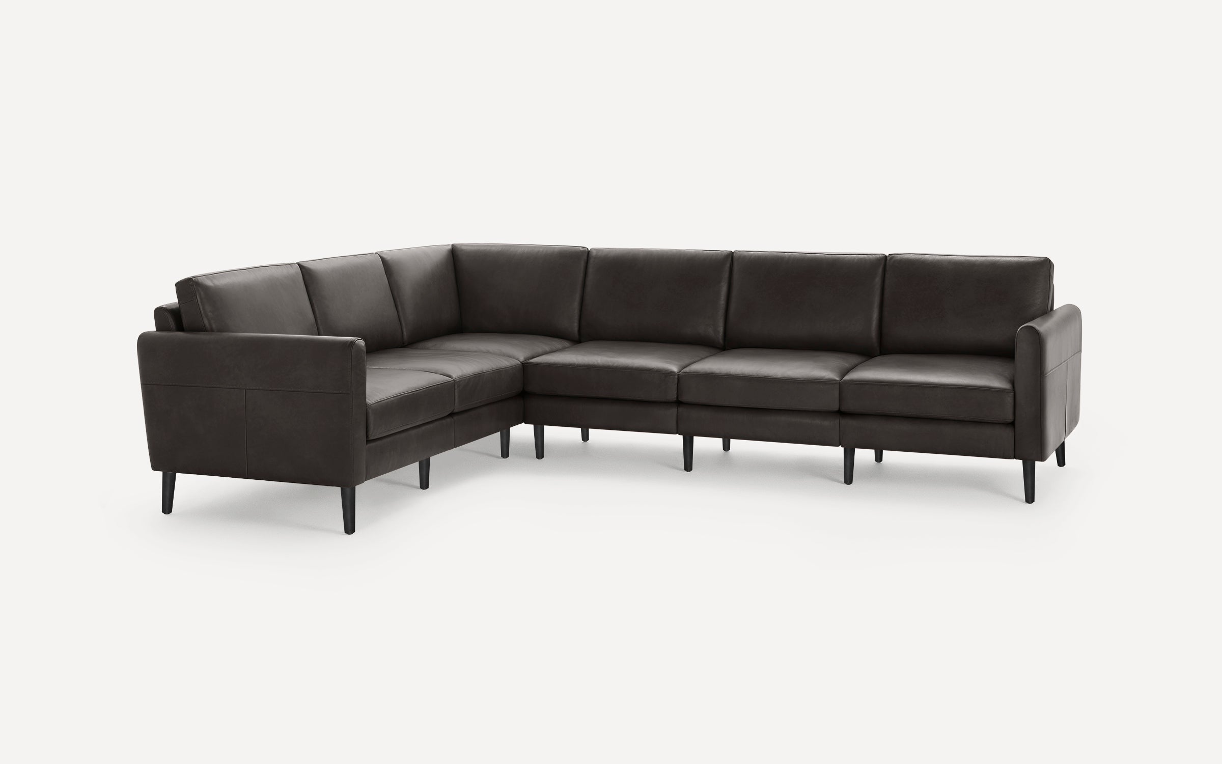 Dark brown leather L-shaped sectional sofa with clean lines, cushioned seats, and black tapered legs on a white background.