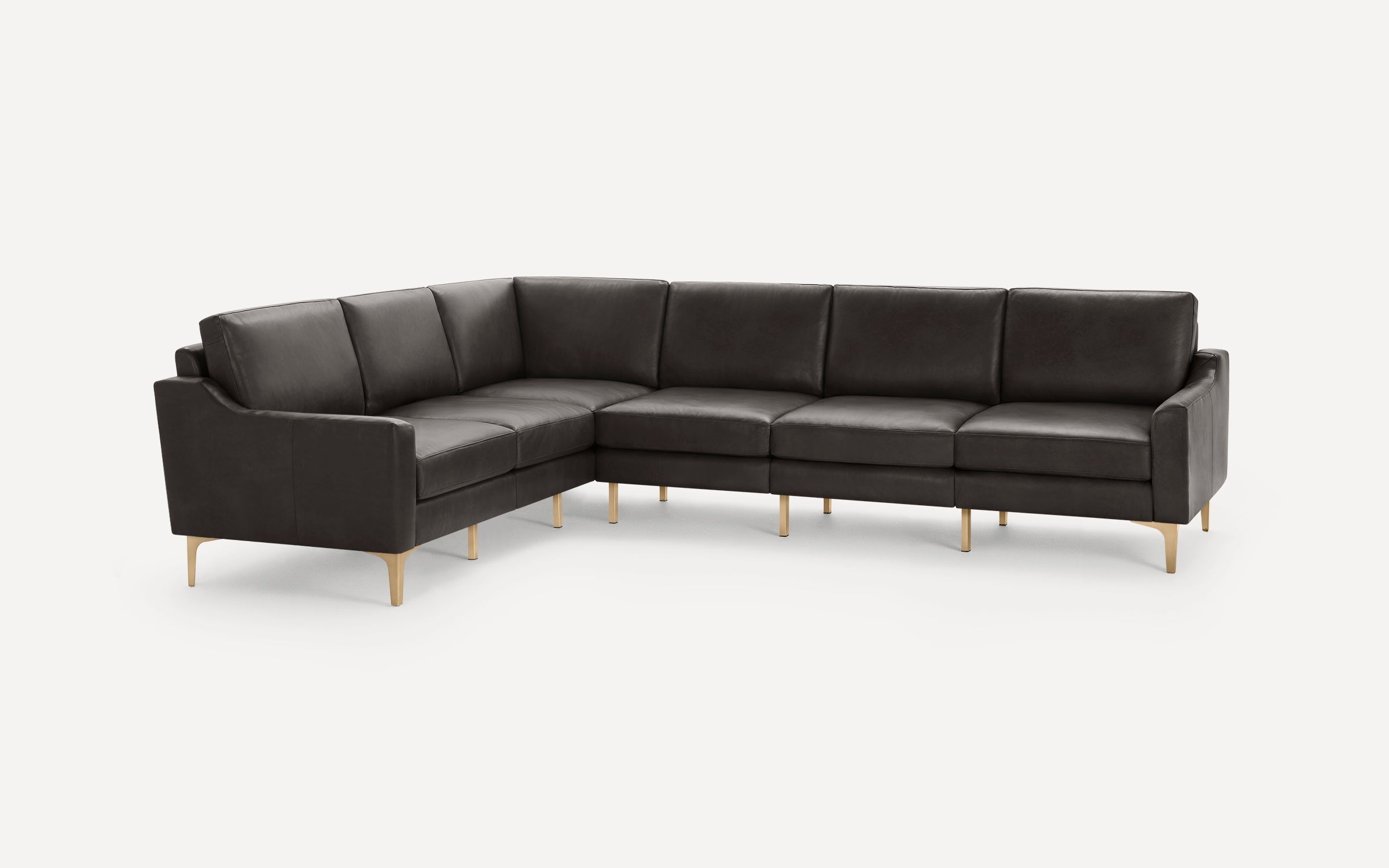 Dark gray leather sectional sofa with clean lines and gold-toned metal legs, designed in a modern, minimalist style.