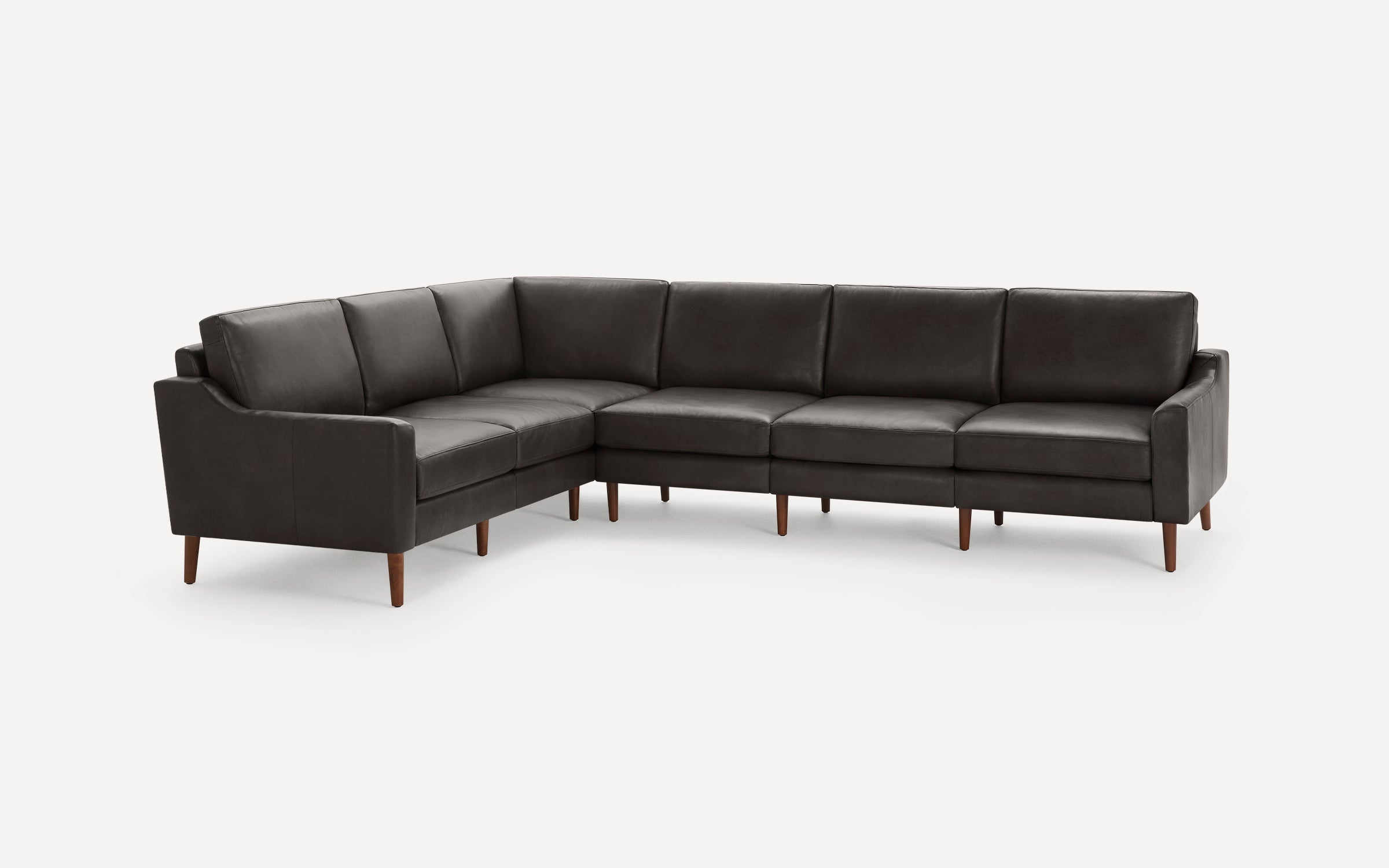 Dark gray leather L-shaped sectional sofa with clean lines and tapered wooden legs, modern minimalist design.