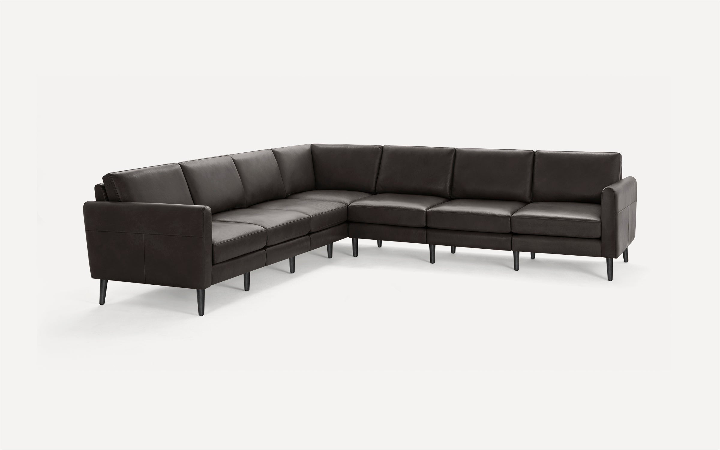 Large modern dark brown leather L-shaped sectional sofa with slim legs, clean lines, and comfortable cushions, ideal for spacious living rooms.