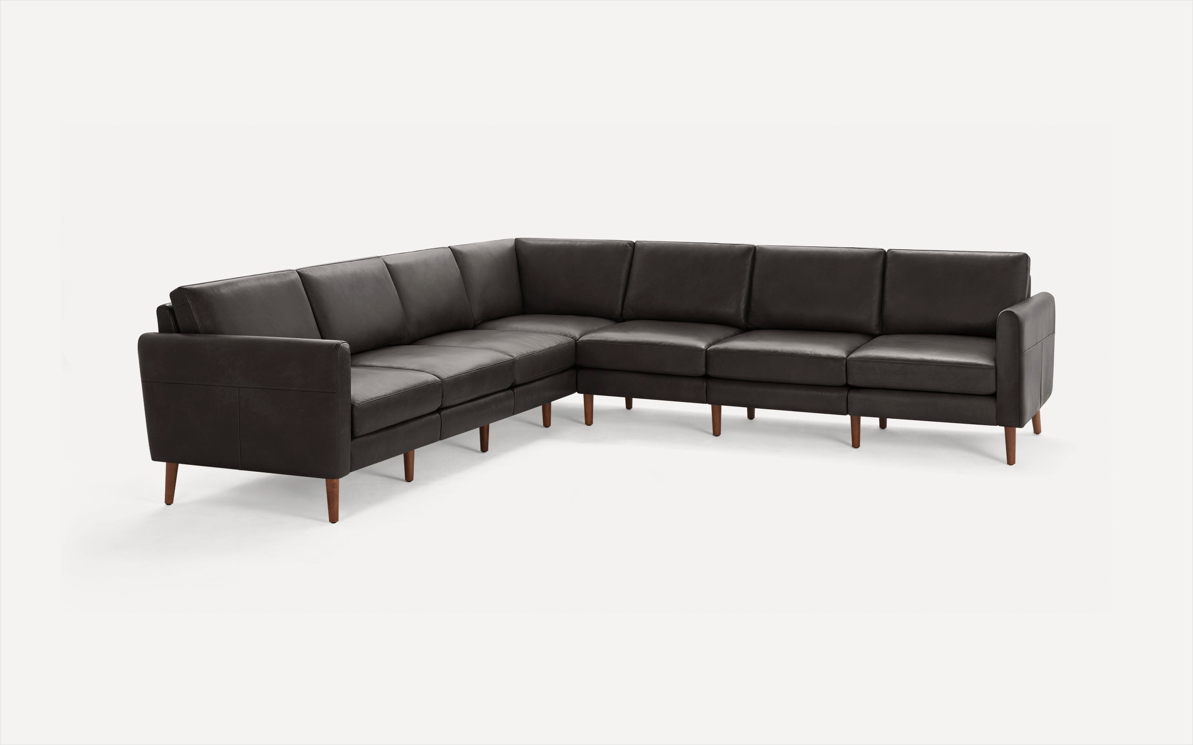 Dark brown leather L-shaped sectional sofa with wooden legs, clean modern design, padded cushions, and low armrests.