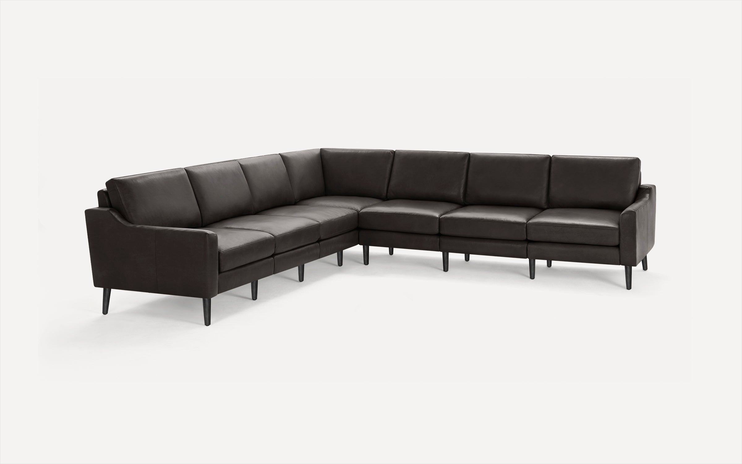 Dark brown leather L-shaped sectional sofa with sleek tapered black legs and cushioned seats and backs.