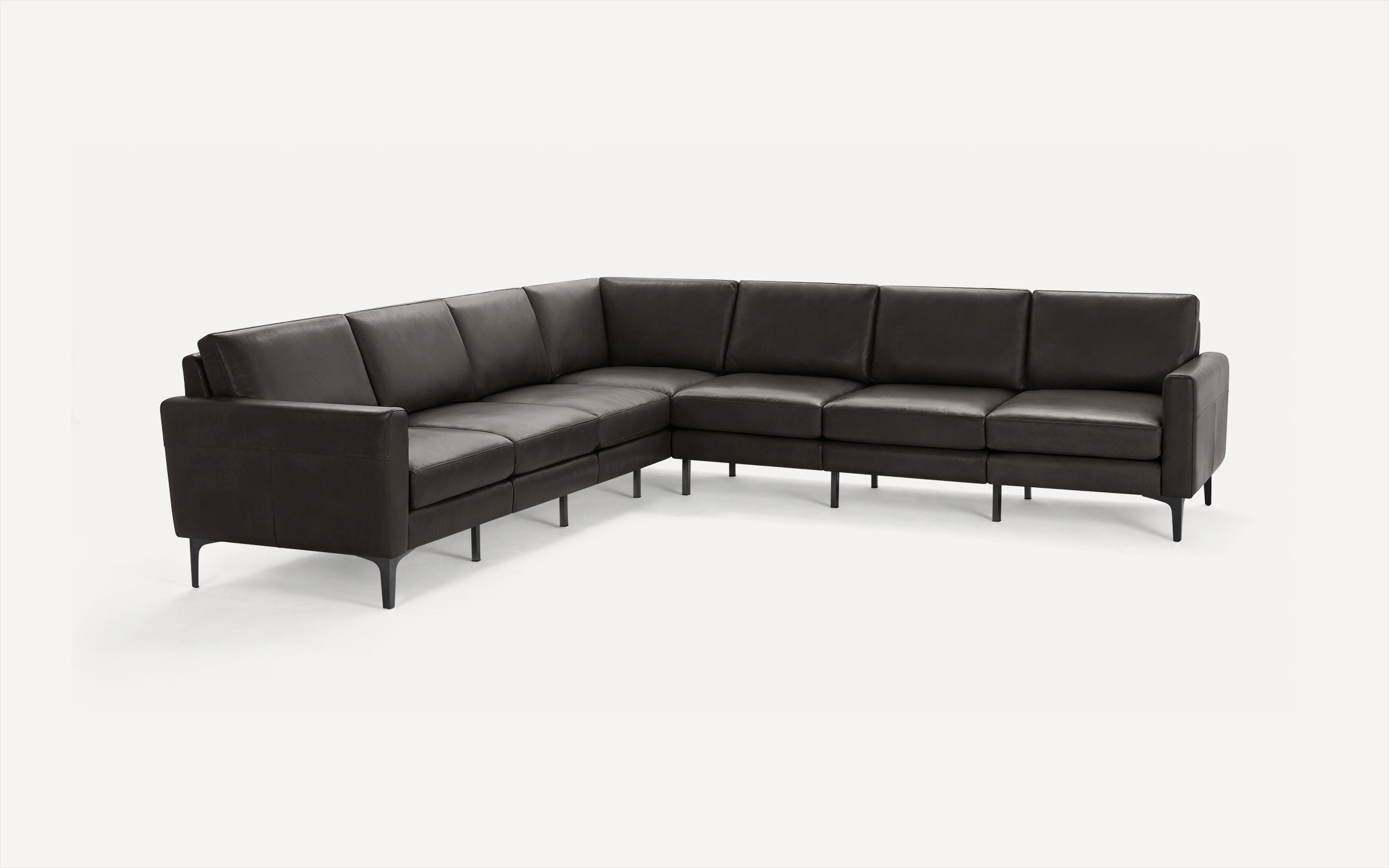 Dark brown leather L-shaped sectional sofa with slim black legs and cushioned back and seat.