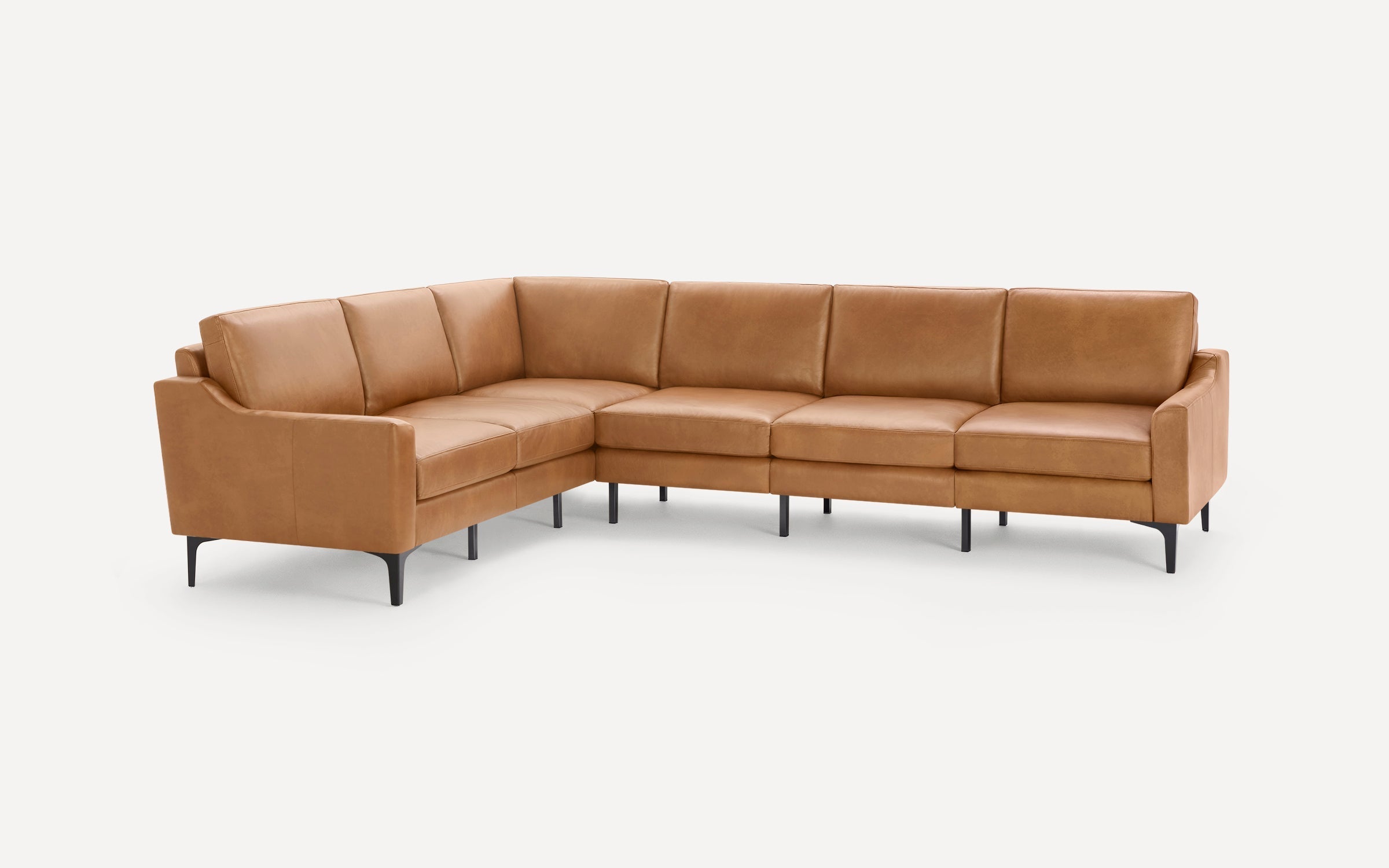 L-shaped sectional sofa in tan leather with sleek black legs, featuring clean lines and modern design.