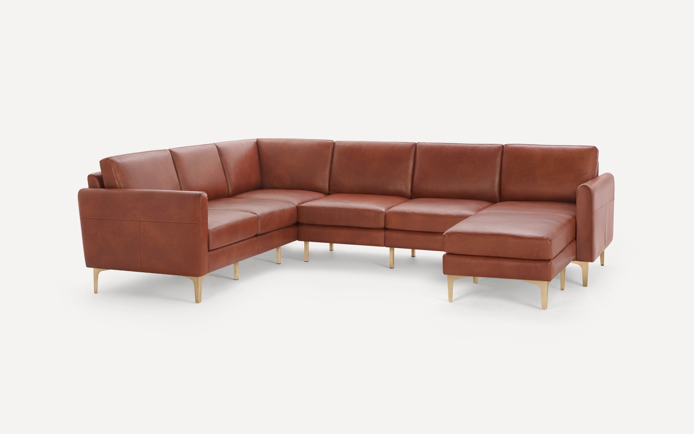Modern L-shaped sectional sofa in rich brown leather with clean lines and sleek gold metal legs on white background.