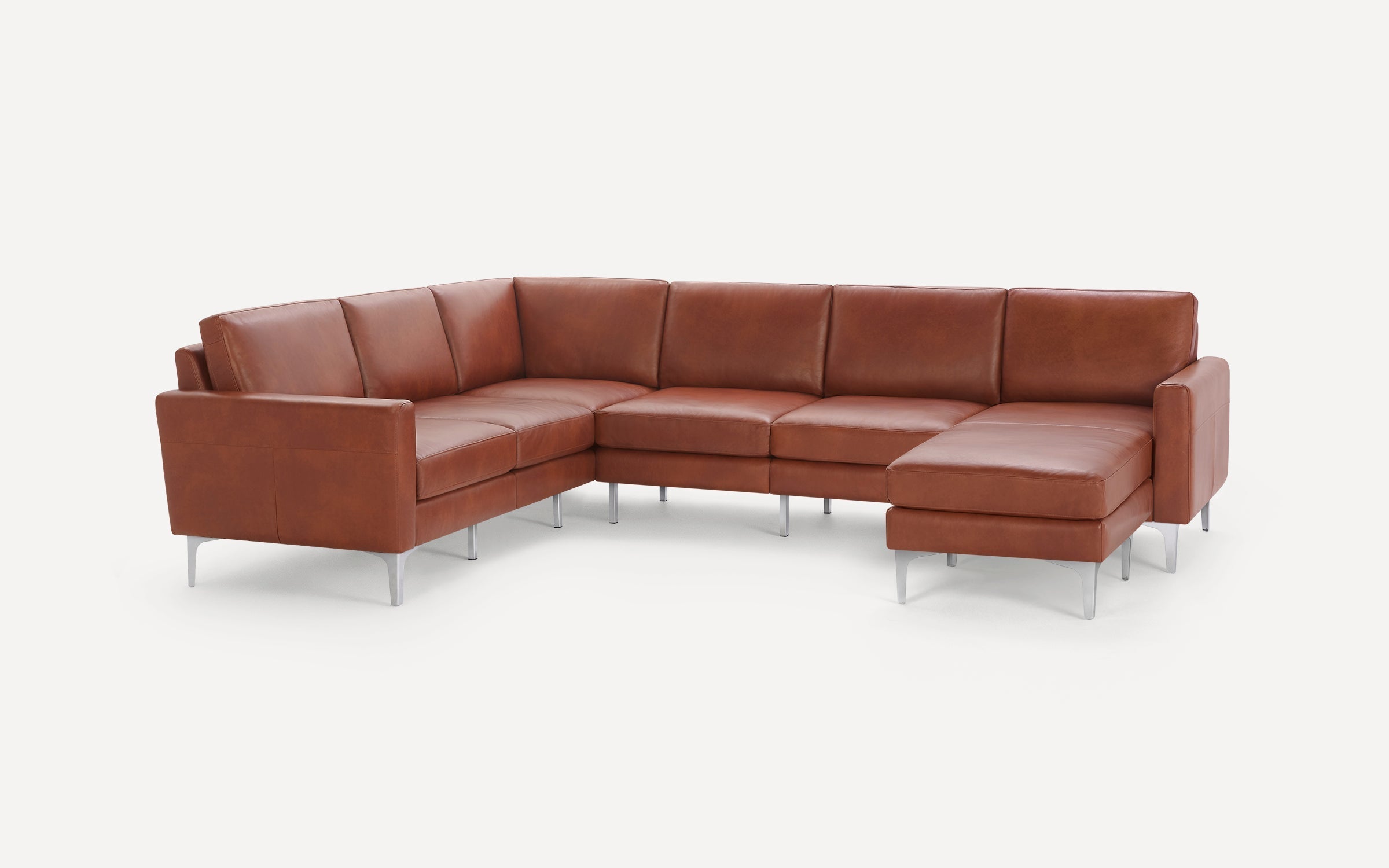 Modern L-shaped sectional sofa with brown leather upholstery and sleek silver metal legs on white background.