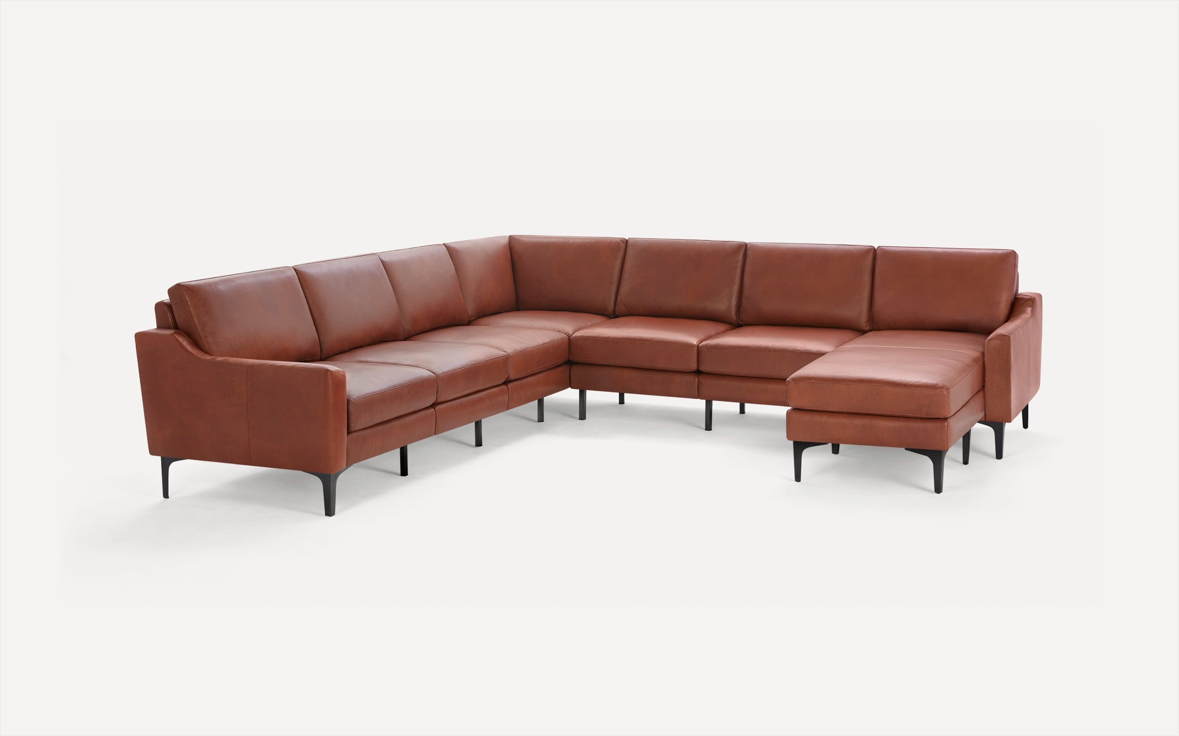 Large modern L-shaped sectional sofa in brown leather with black metal legs, featuring clean lines and cushioned seats.