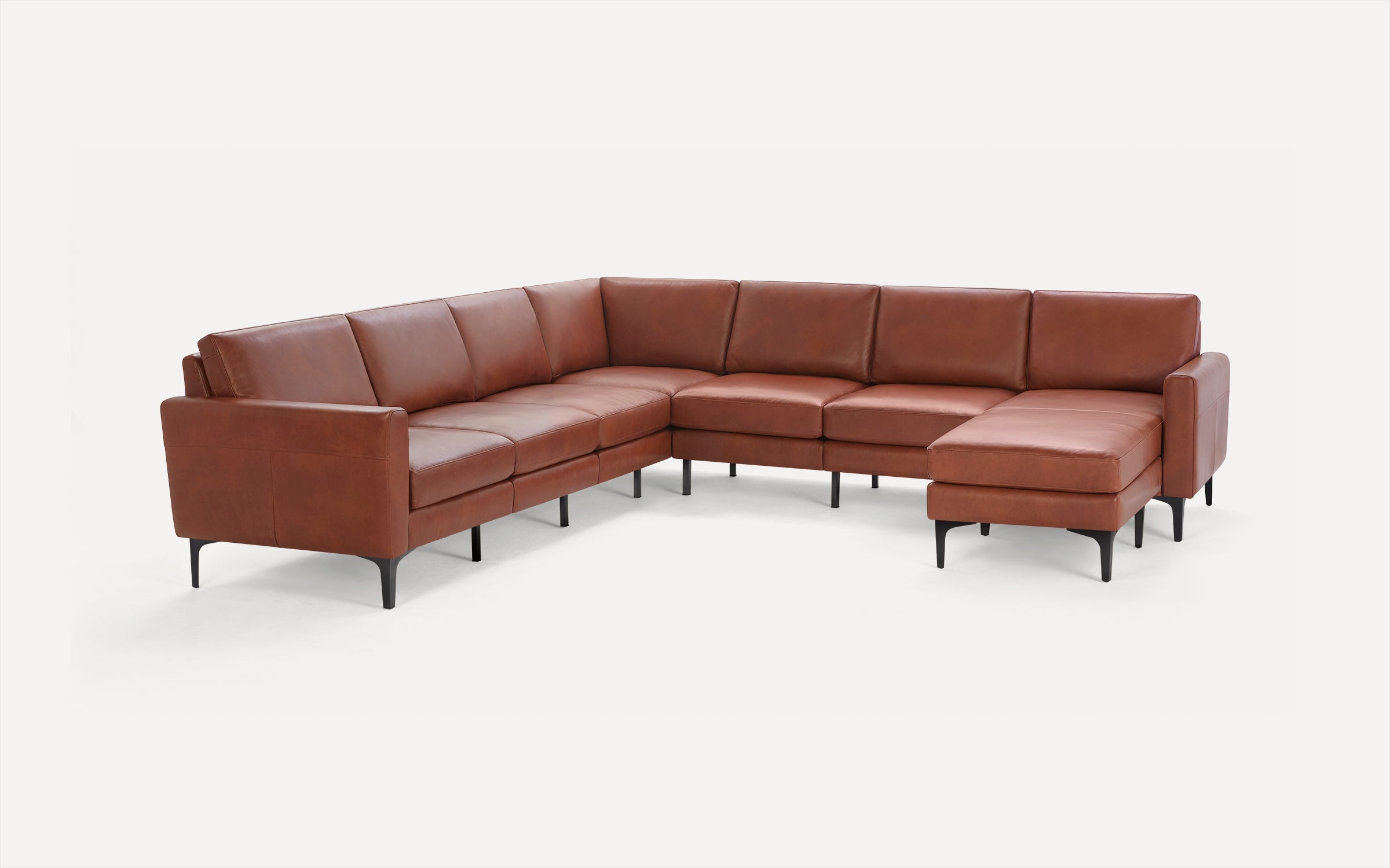 Brown leather sectional sofa with clean lines, black metal legs, and a right-side chaise lounge on a white background.