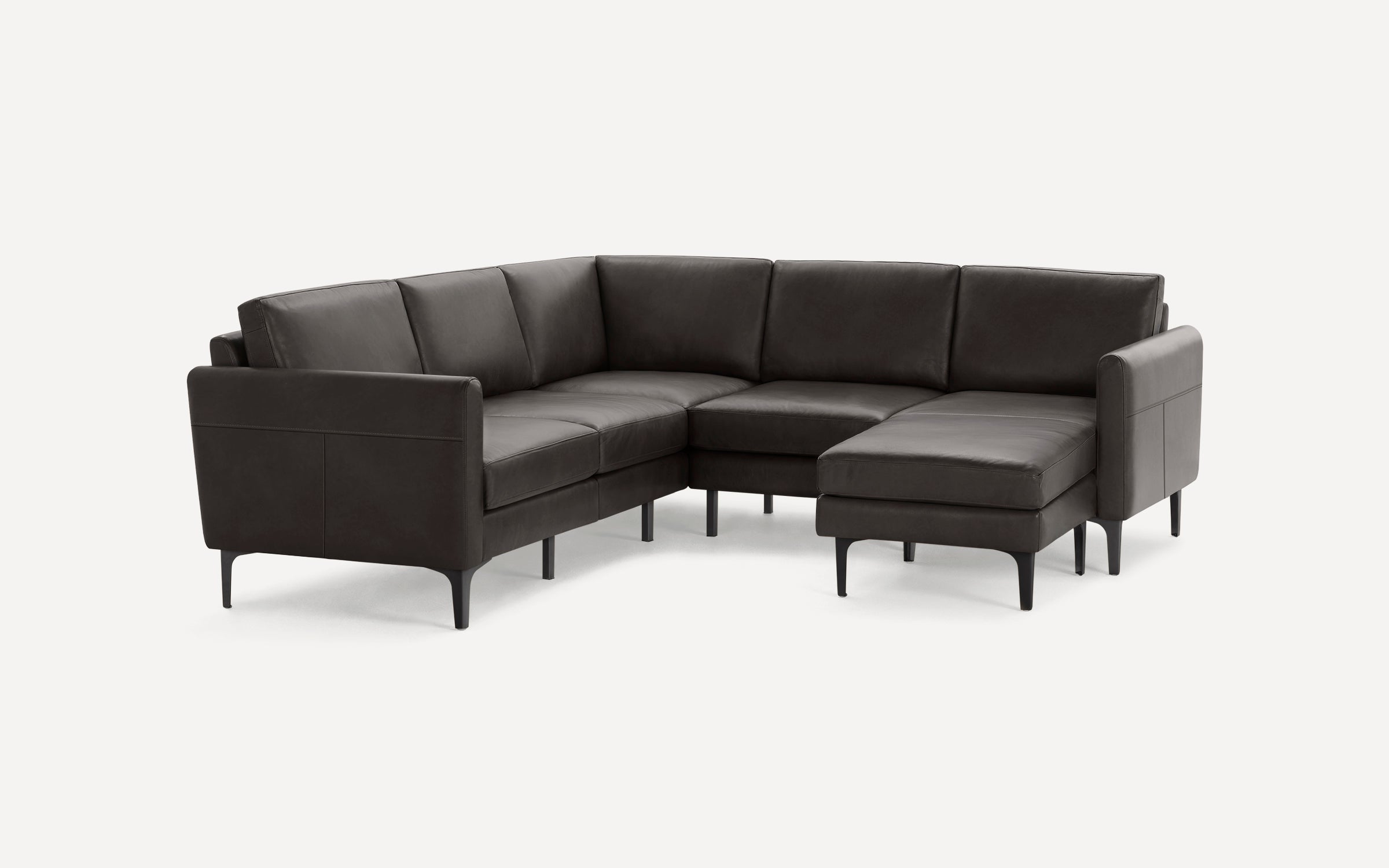 Modern dark gray leather sectional sofa with clean lines, slim black legs, and a right-side chaise lounge.
