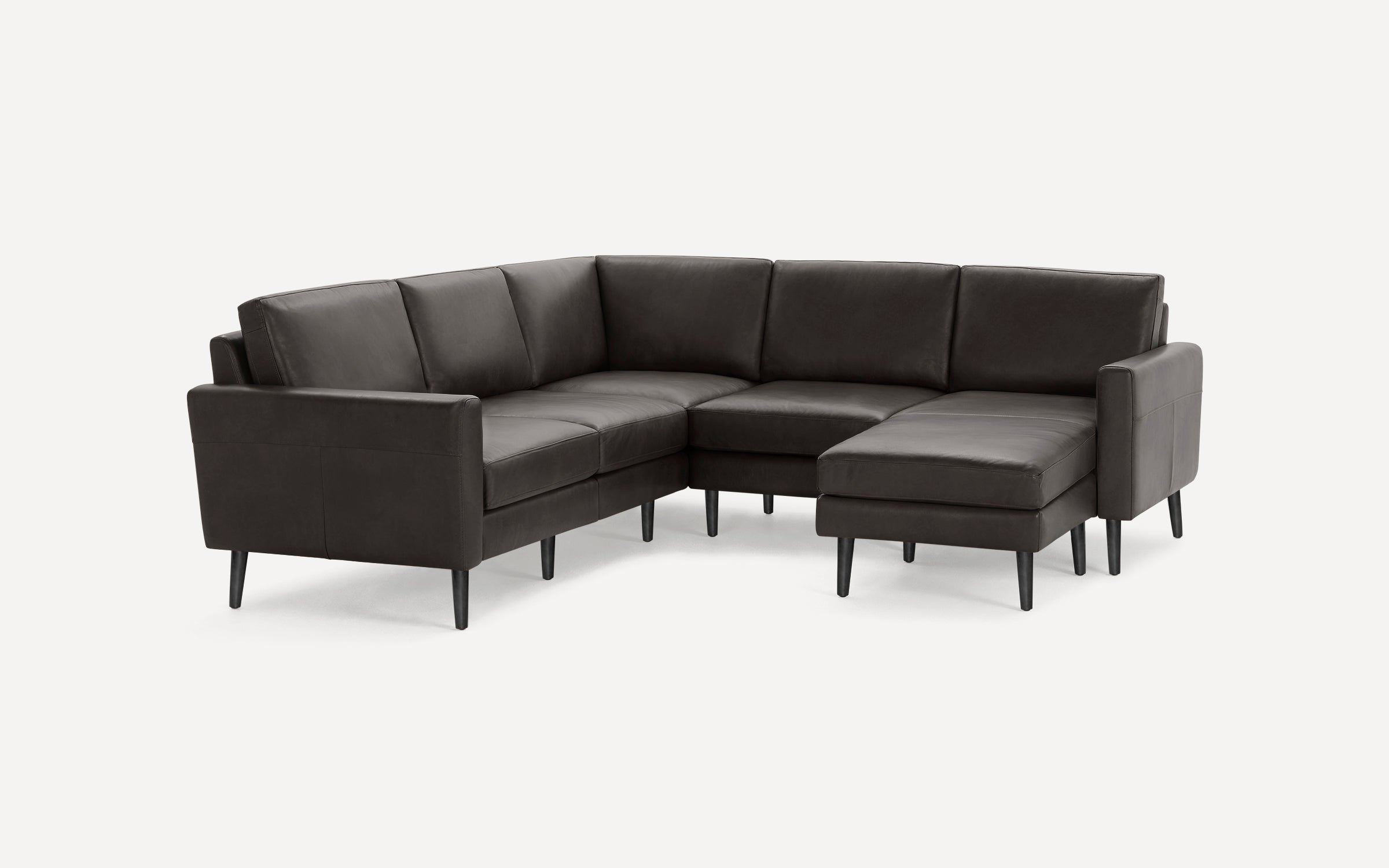 Modern dark gray sectional sofa with clean lines, cushioned seats, and slim black tapered legs on a white background.
