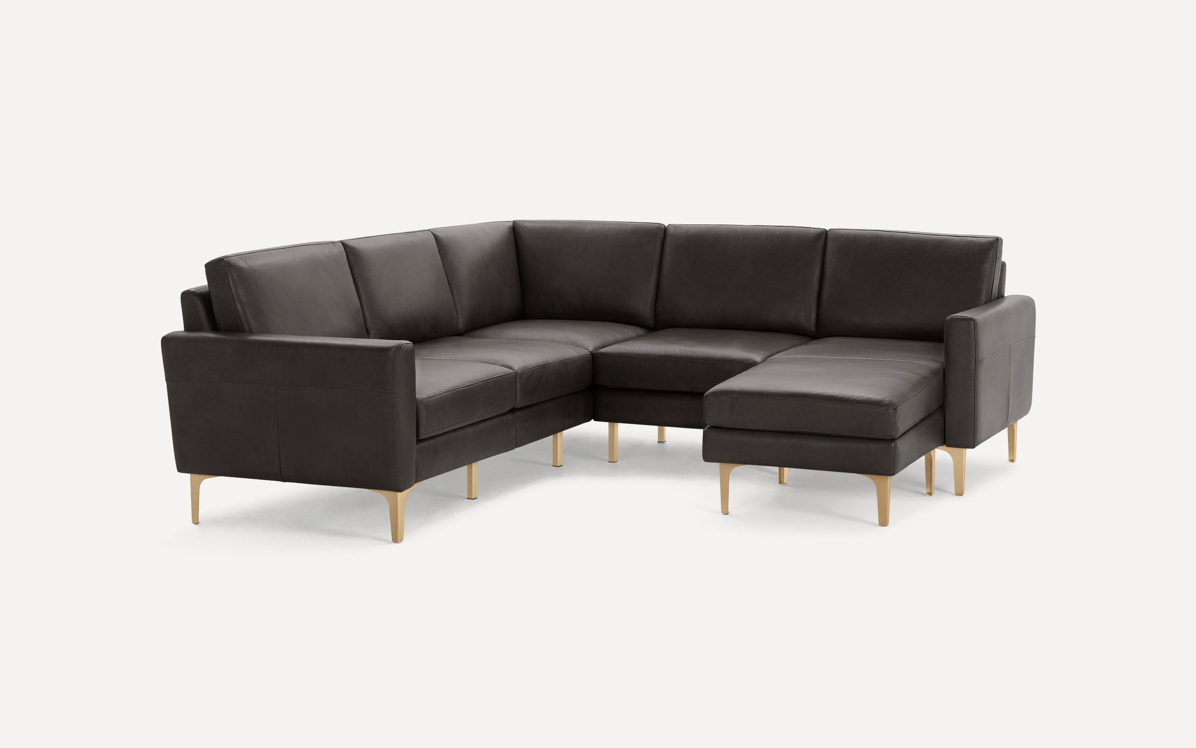 Modern dark gray leather L-shaped sectional sofa with gold metal legs, featuring clean lines and cushioned seats.