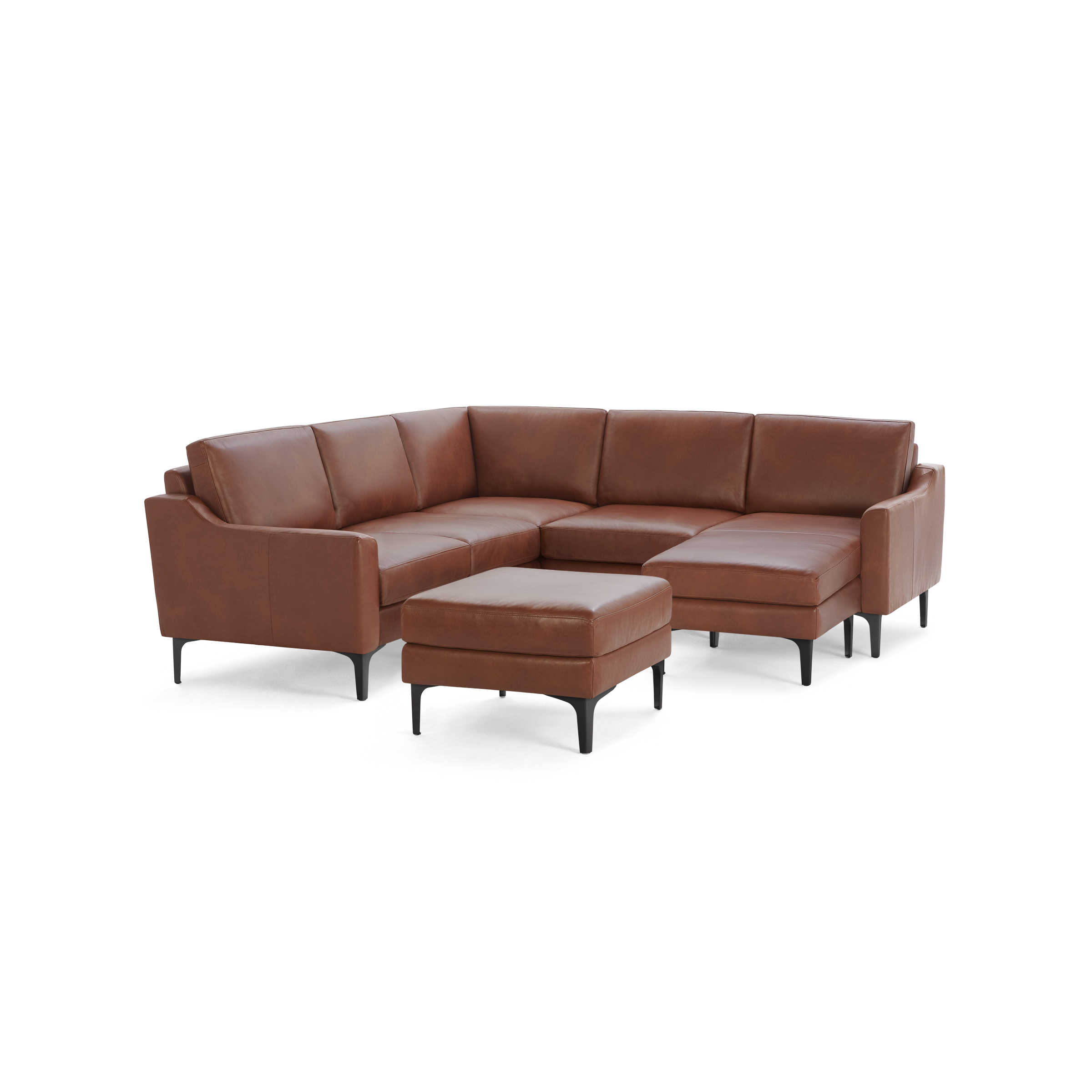 Brown leather sectional sofa with a matching ottoman, black legs, and modern, sleek design.