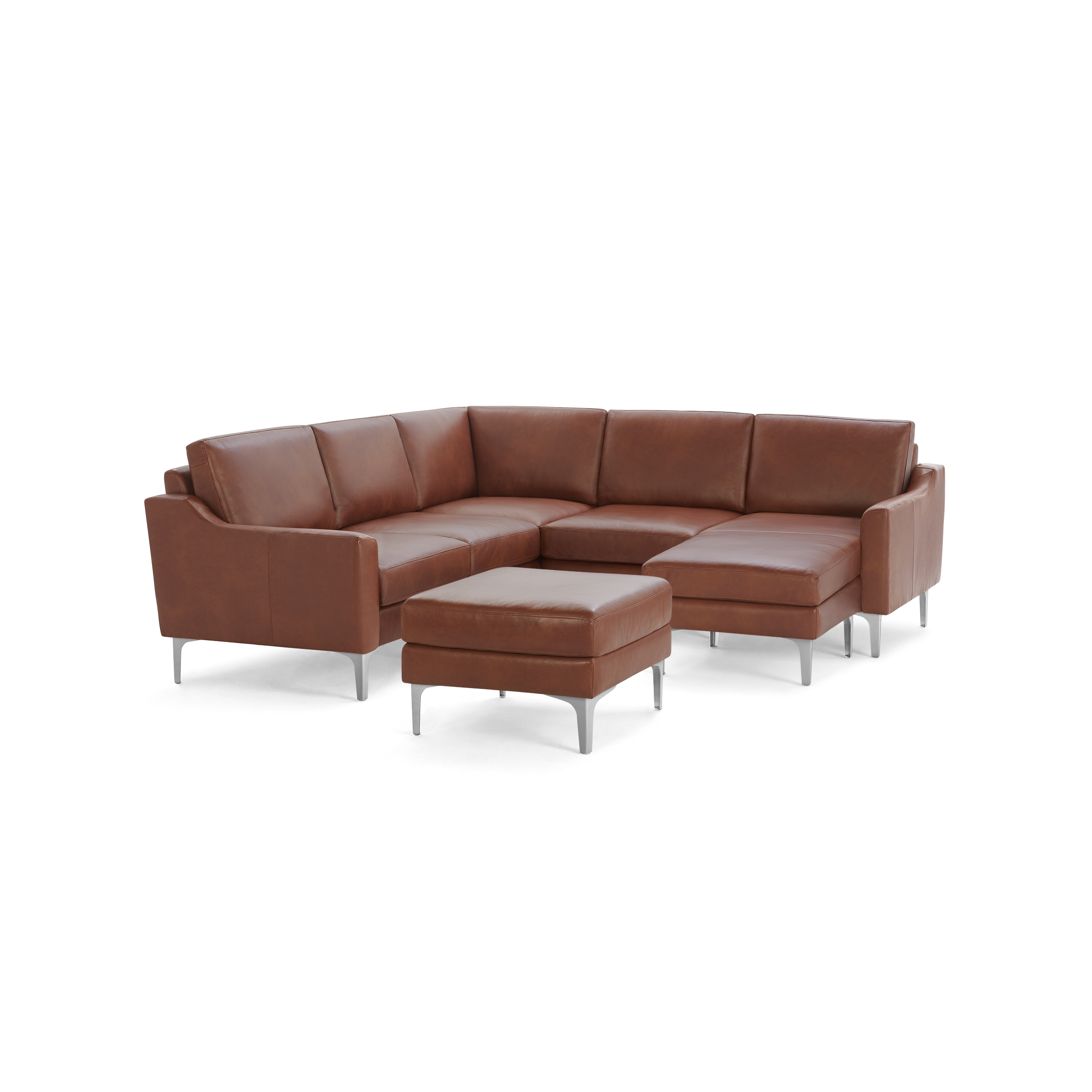 Brown leather L-shaped sectional sofa with clean lines, metal legs, and matching ottoman against black background.