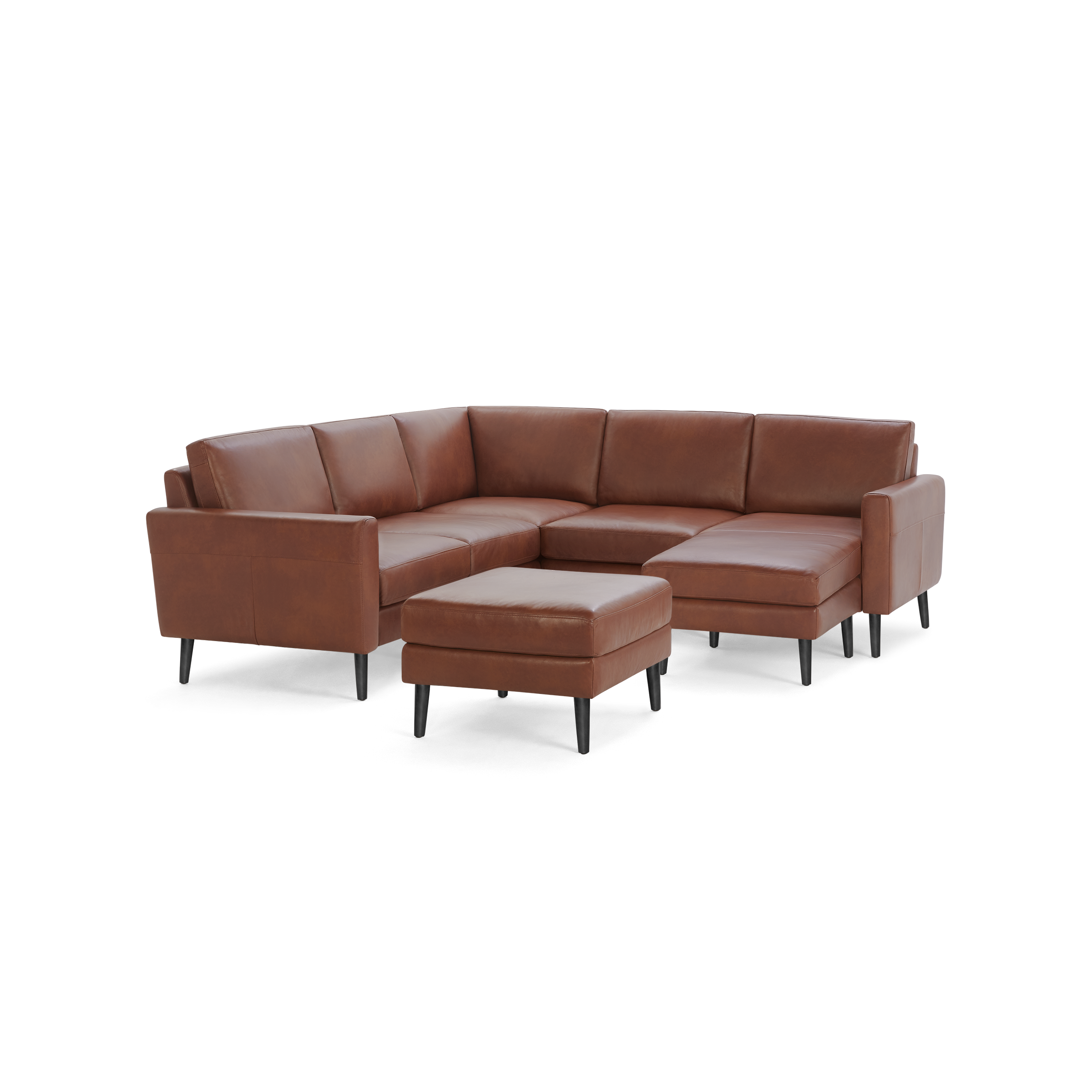 Brown leather sectional sofa with matching ottoman, featuring sleek black legs and modern design.