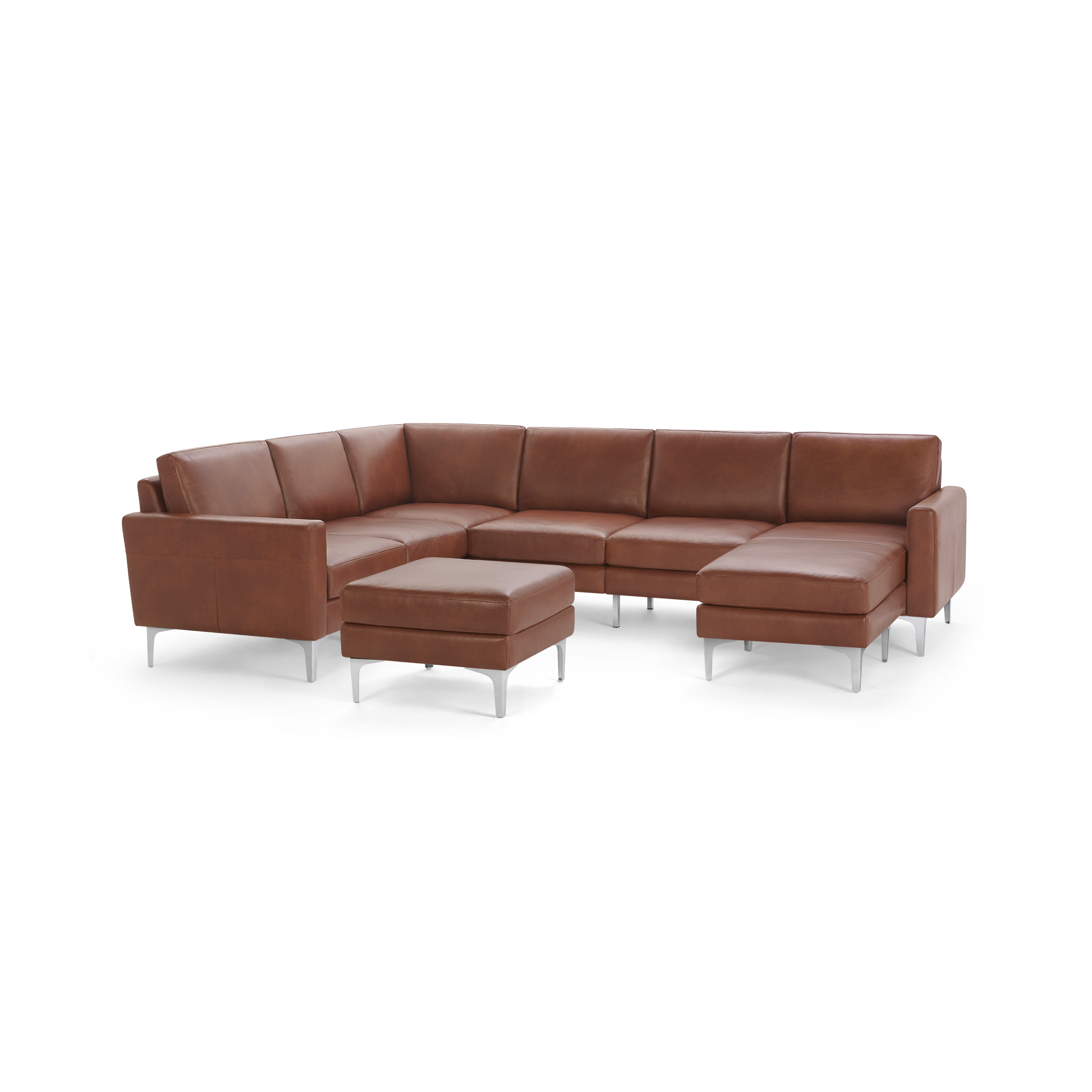 Modern brown leather sectional sofa with metal legs and matching ottoman, featuring clean lines and plush cushions.