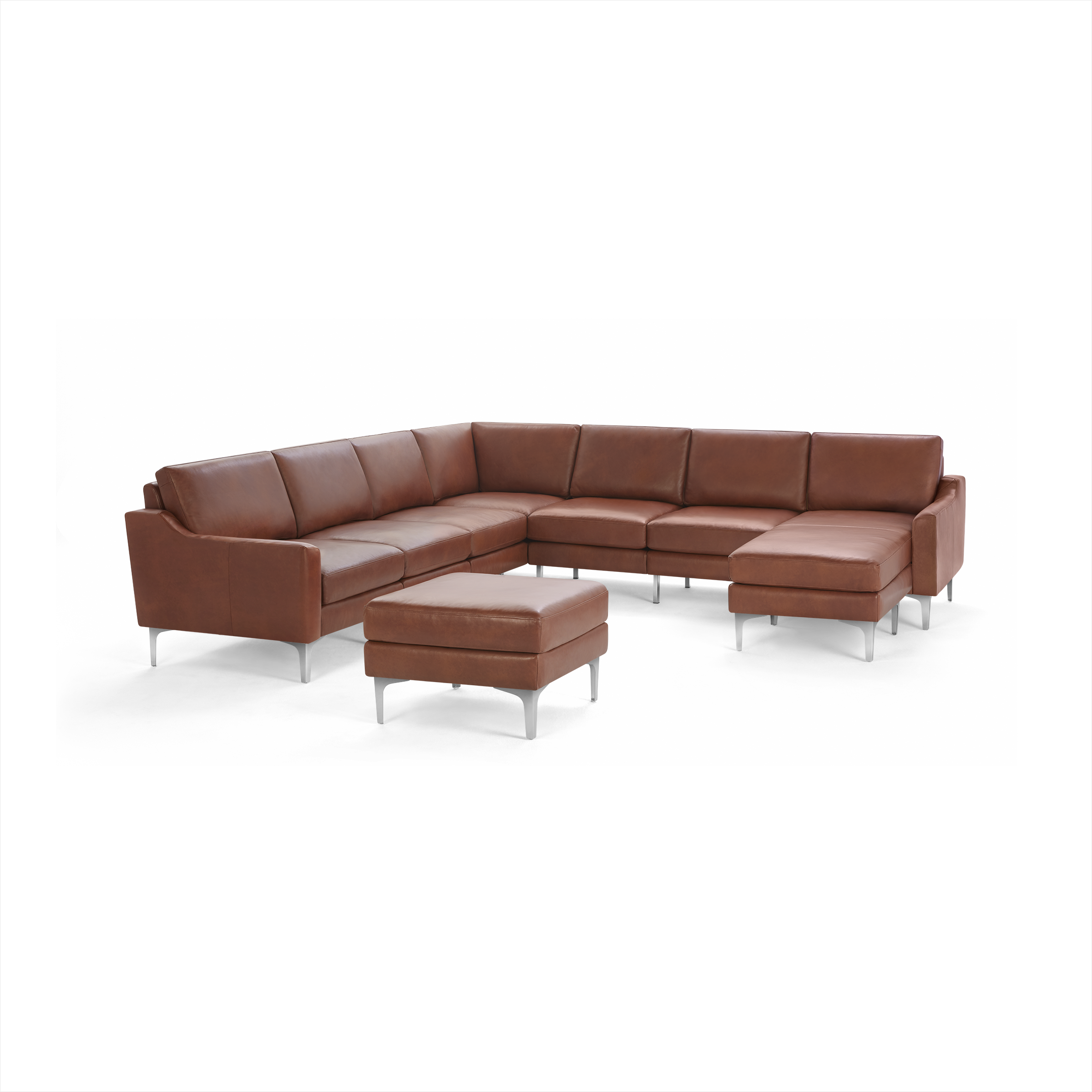 Modern L-shaped sectional sofa in brown leather with sleek metal legs and matching ottoman.