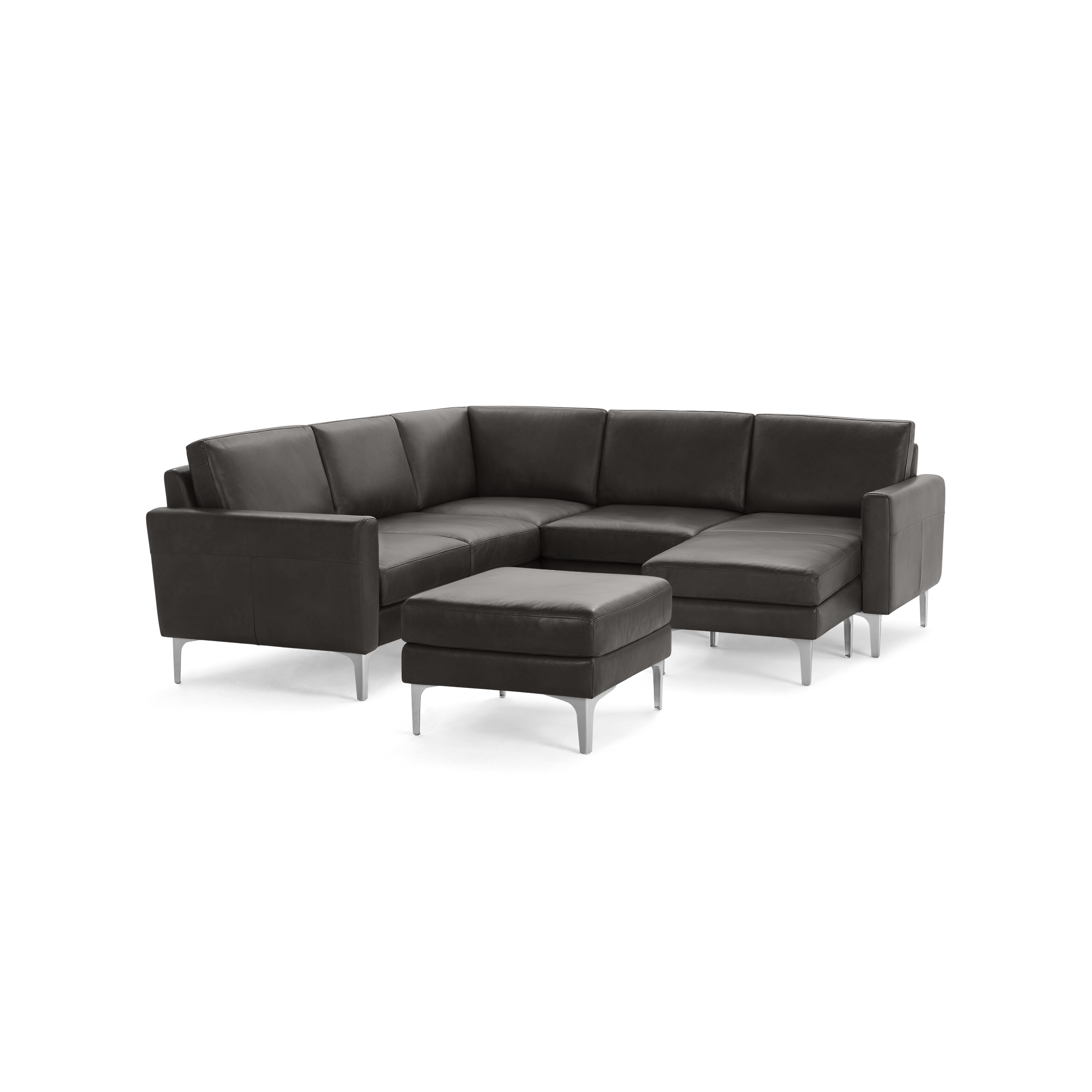 Dark gray leather sectional sofa with metal legs and a matching ottoman, featuring clean lines and modern design.