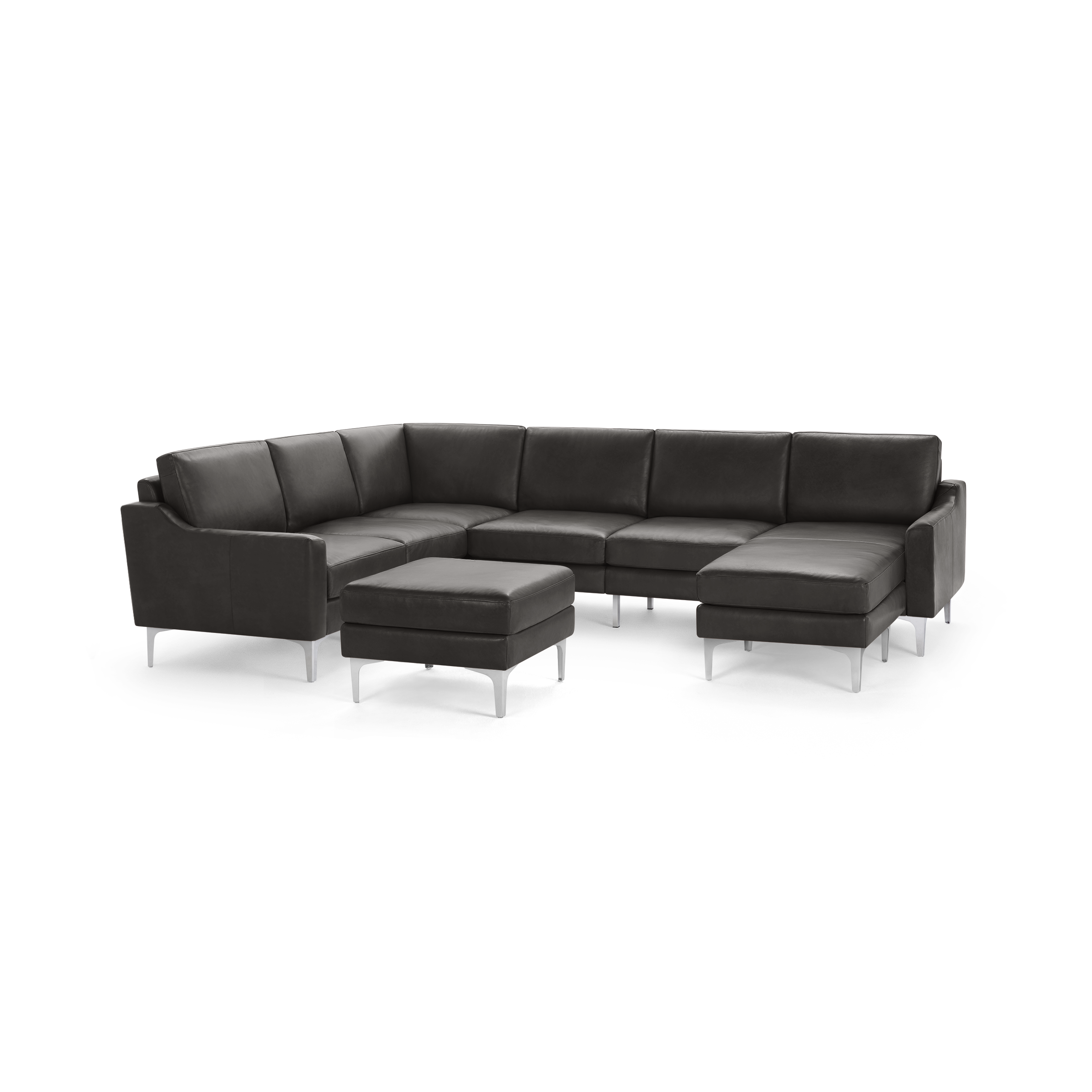 Modern dark gray leather sectional sofa with clean lines, metal legs, and a matching ottoman for extra seating or footrest.