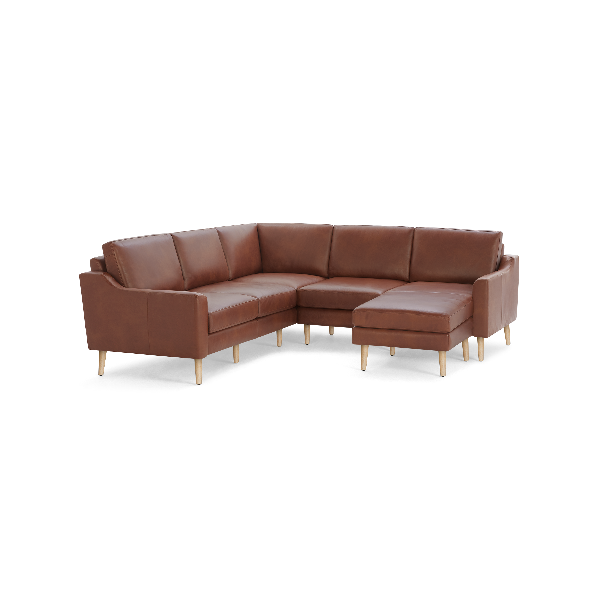 Brown leather L-shaped sectional sofa with wooden tapered legs and cushioned seats and backrests.