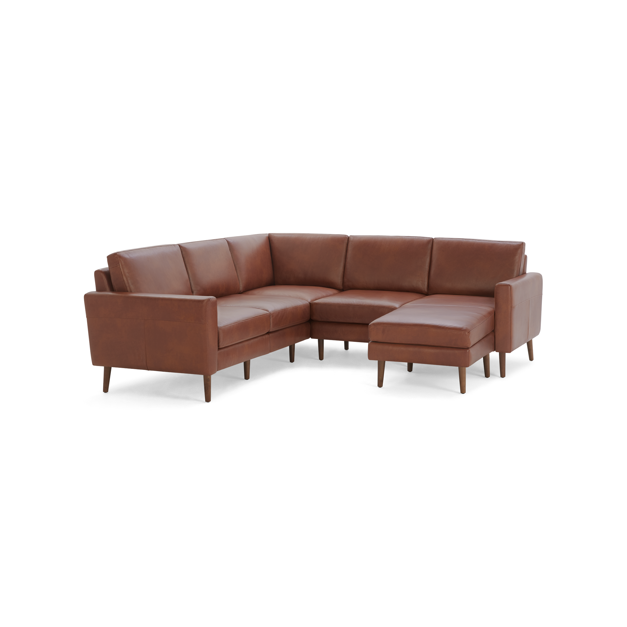 Brown leather L-shaped sectional sofa with wooden legs and clean, modern design.