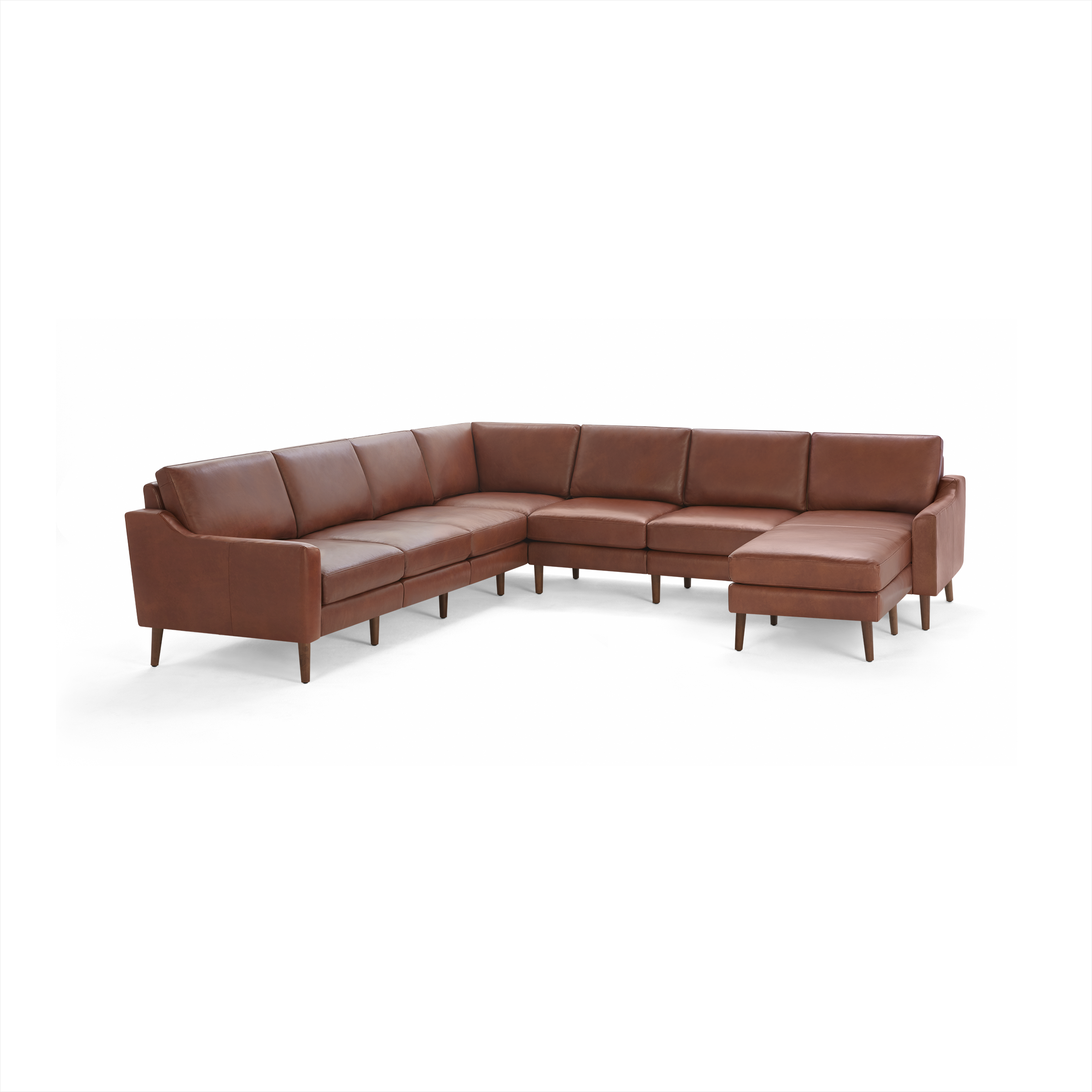 Large L-shaped sectional sofa in rich brown leather with cushioned seats, backrests, and wooden legs, designed for spacious comfort.