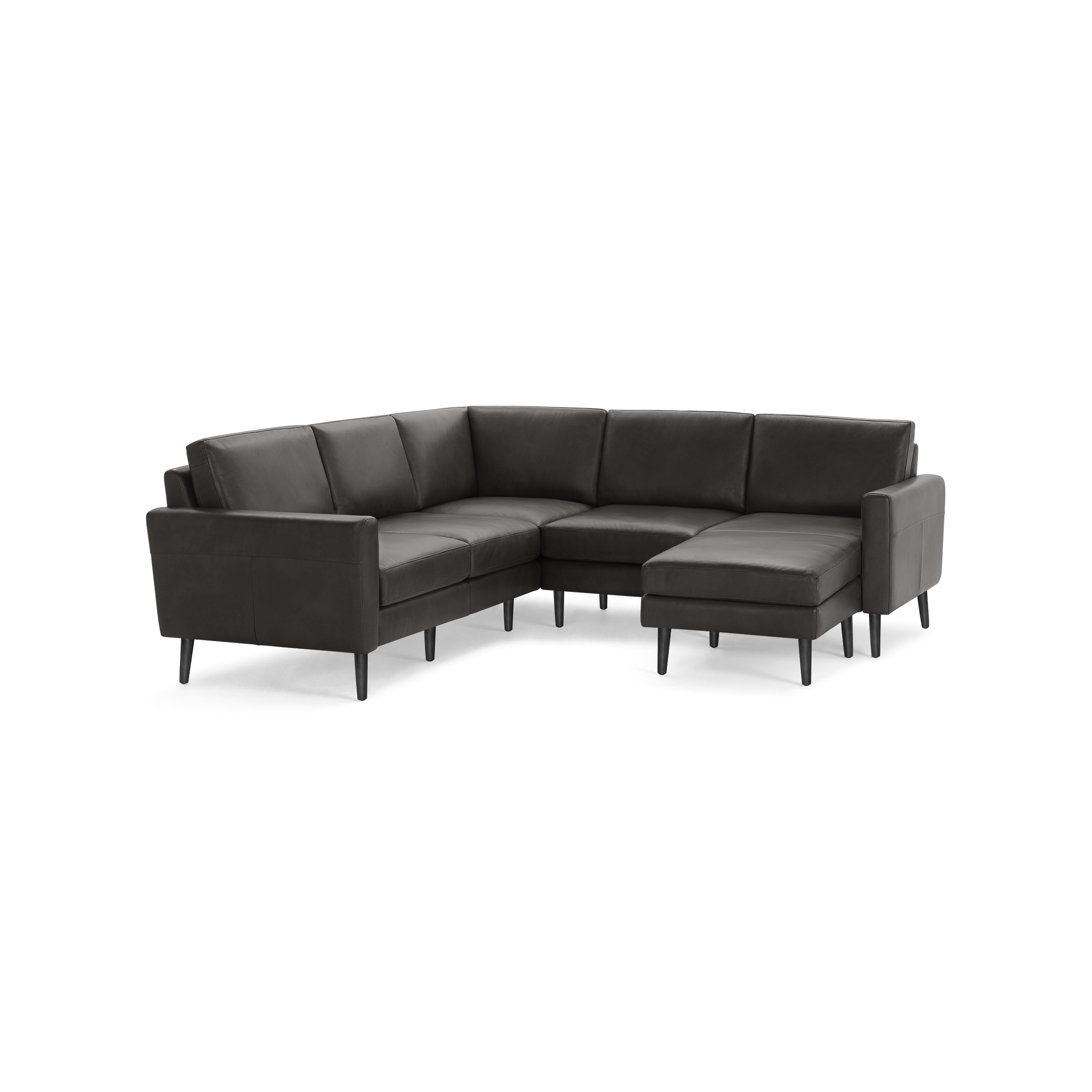 Modern dark gray leather L-shaped sectional sofa with clean lines and slim black legs on a black background.