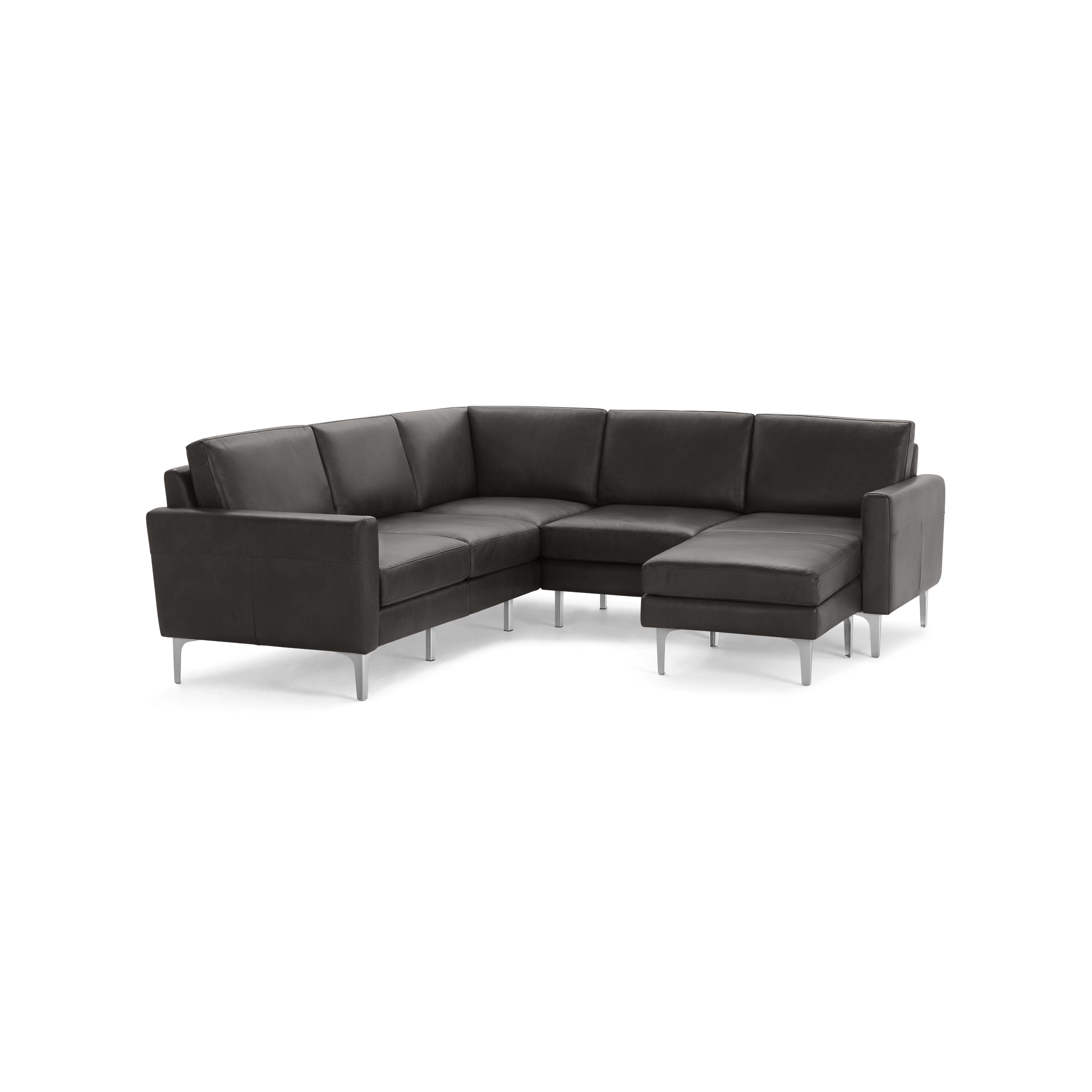 Modern dark gray leather sectional sofa with metal legs, featuring a chaise lounge on the right side.