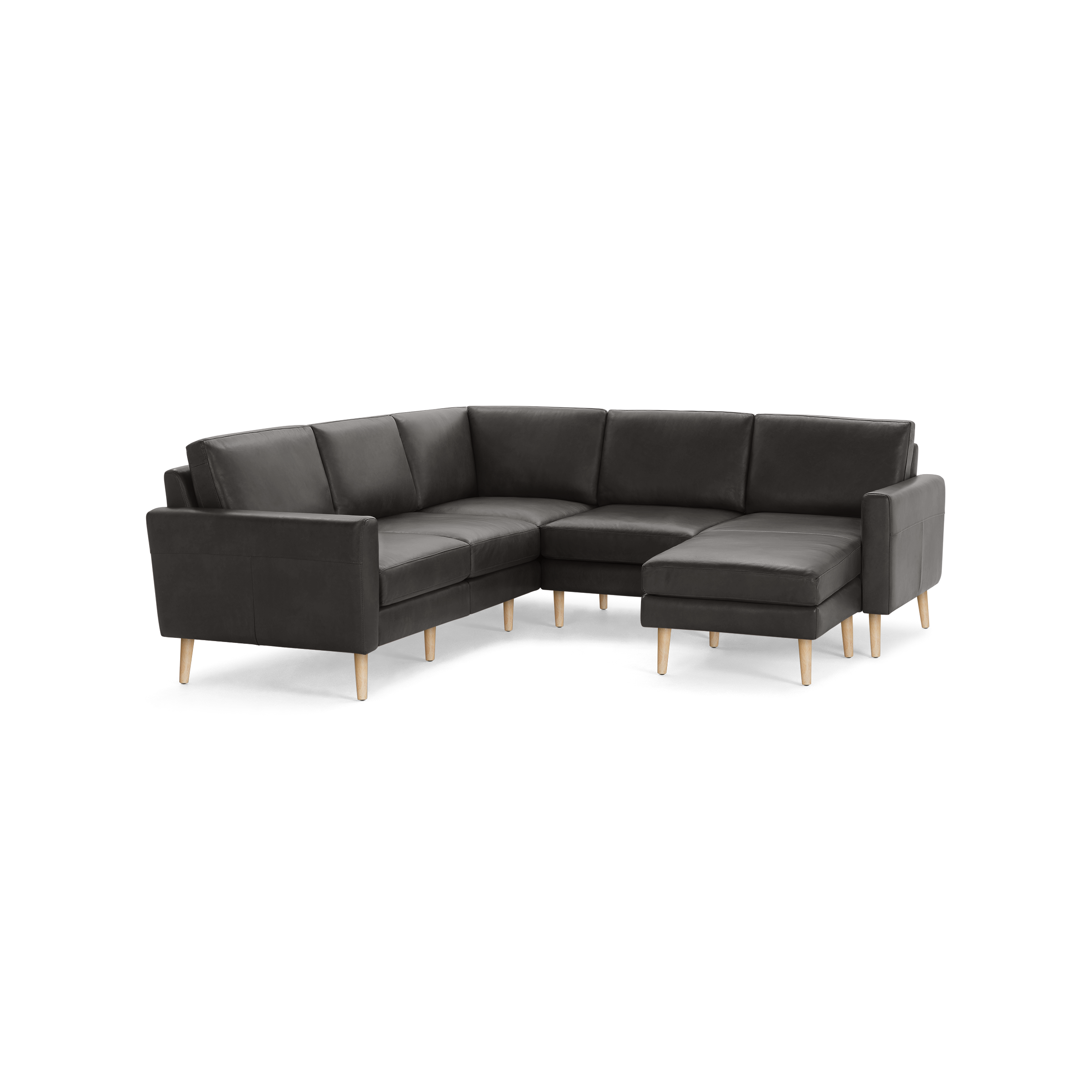 Modern dark gray sectional sofa with wooden legs, featuring a chaise lounge on the right side and cushioned back and seats.