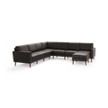 Modern dark gray leather L-shaped sectional sofa with wooden legs and cushioned seats and backrests.