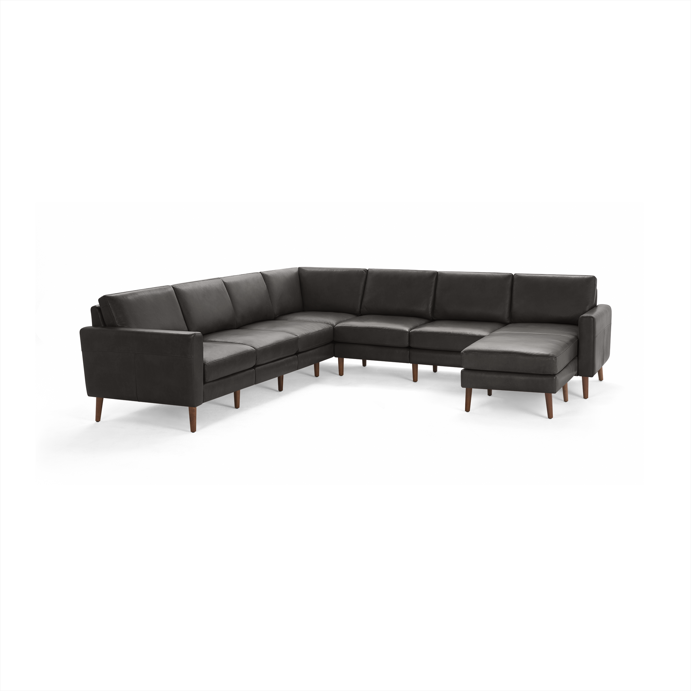 Modern dark gray leather L-shaped sectional sofa with wooden legs and cushioned seats and backrests.